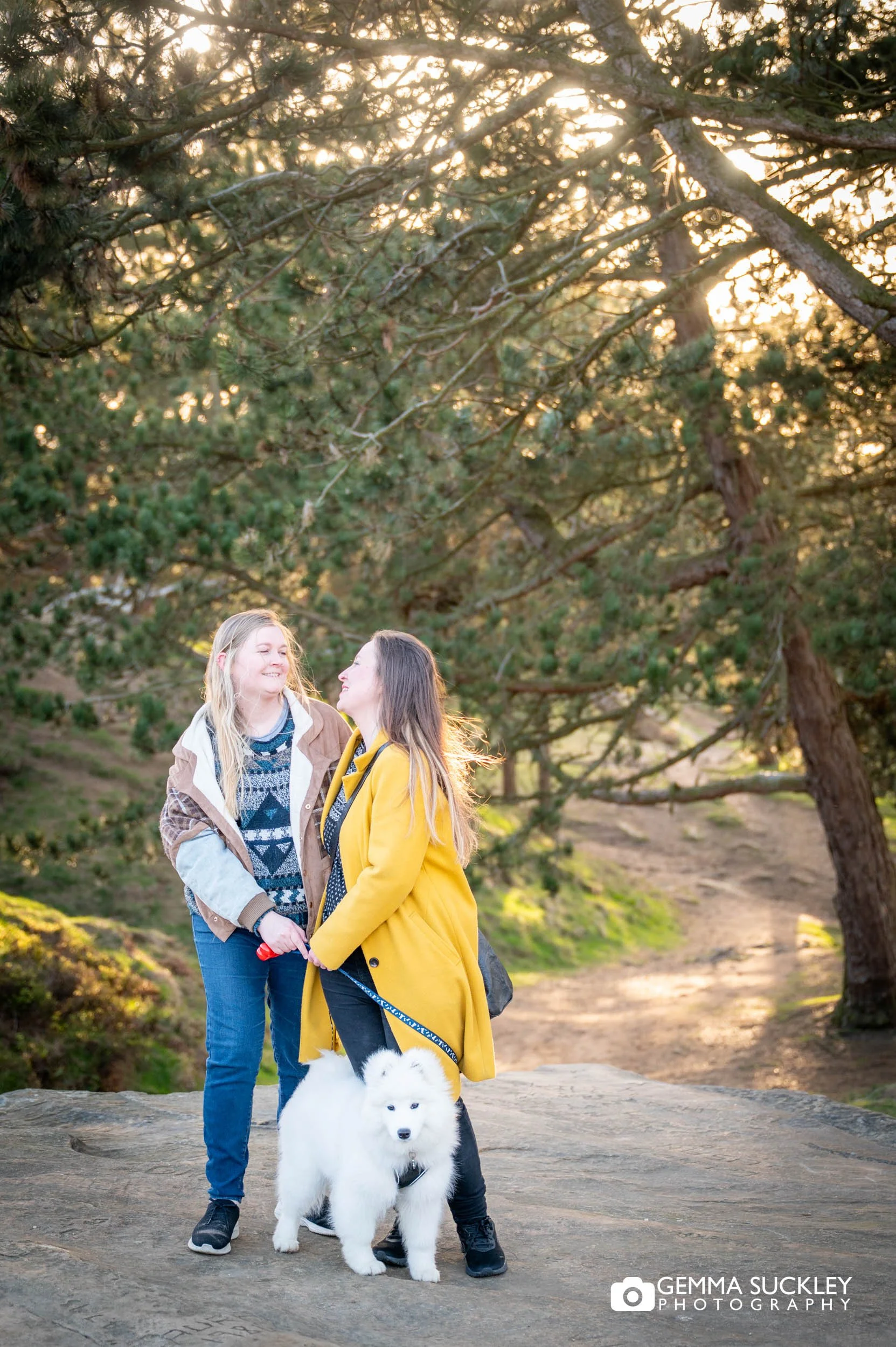 Natural pre-wedding portrait of a couple laughing together on Ilkley Moor