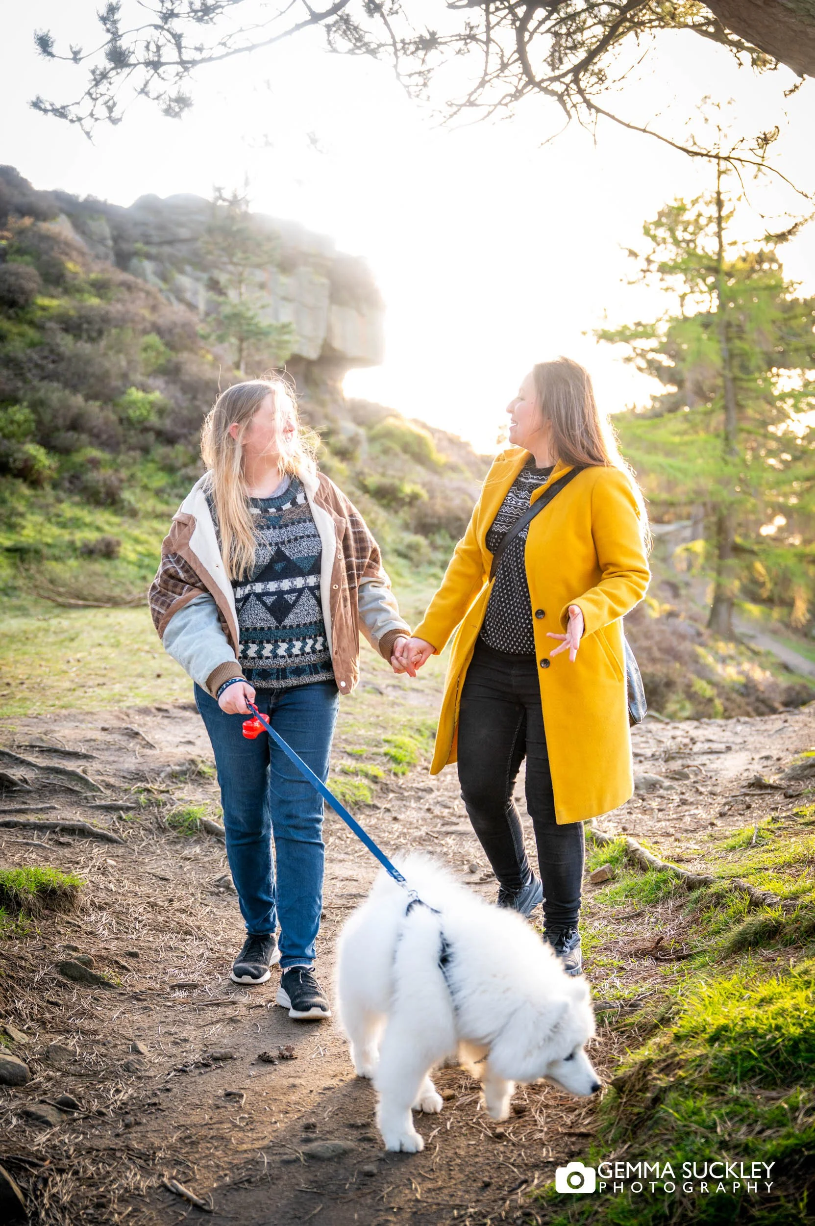 Couple walking across Ilkley Moor at sunset during their Yorkshire pre-wedding photography session