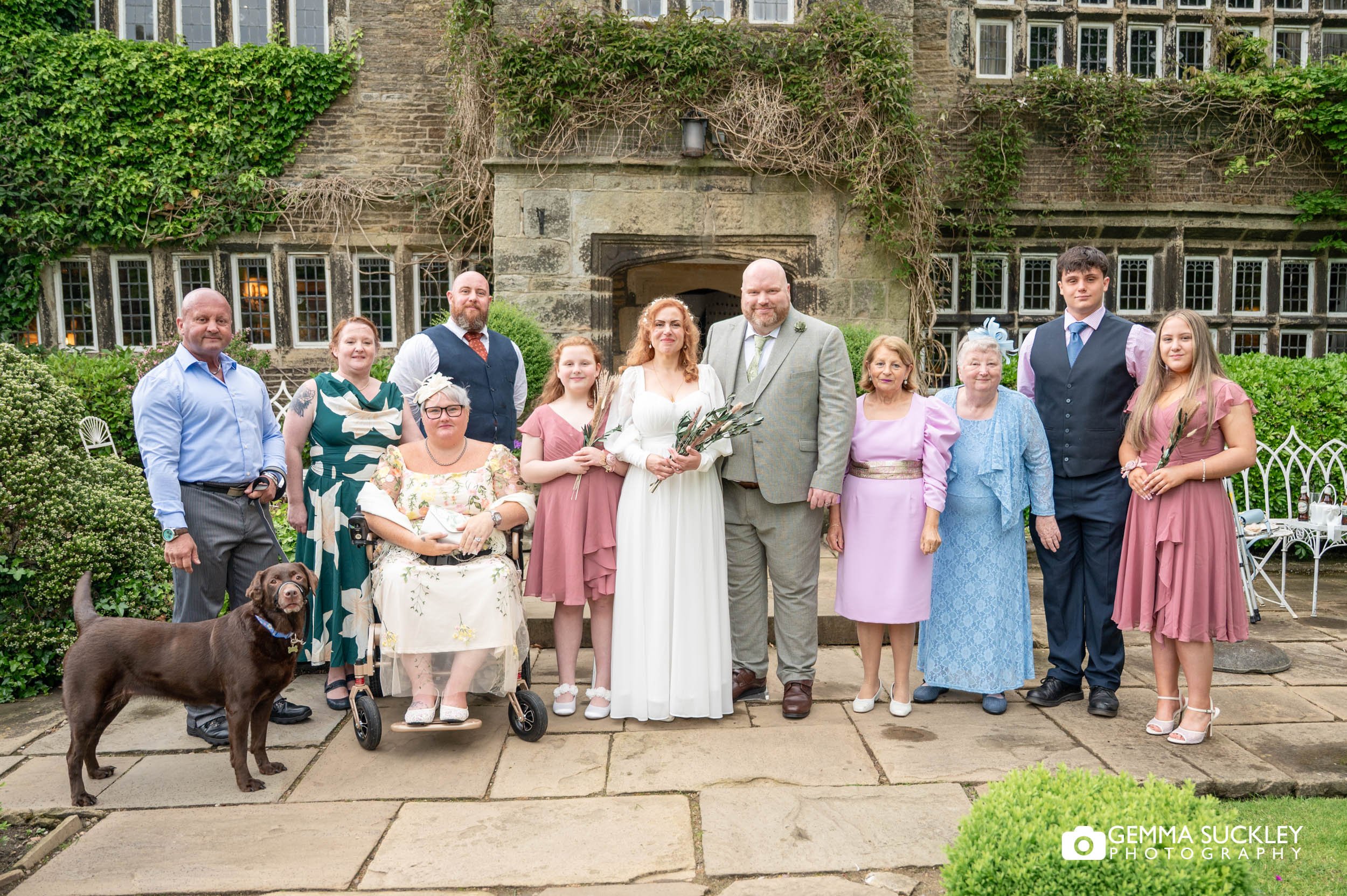 the whole wedding party outside holdsworth house