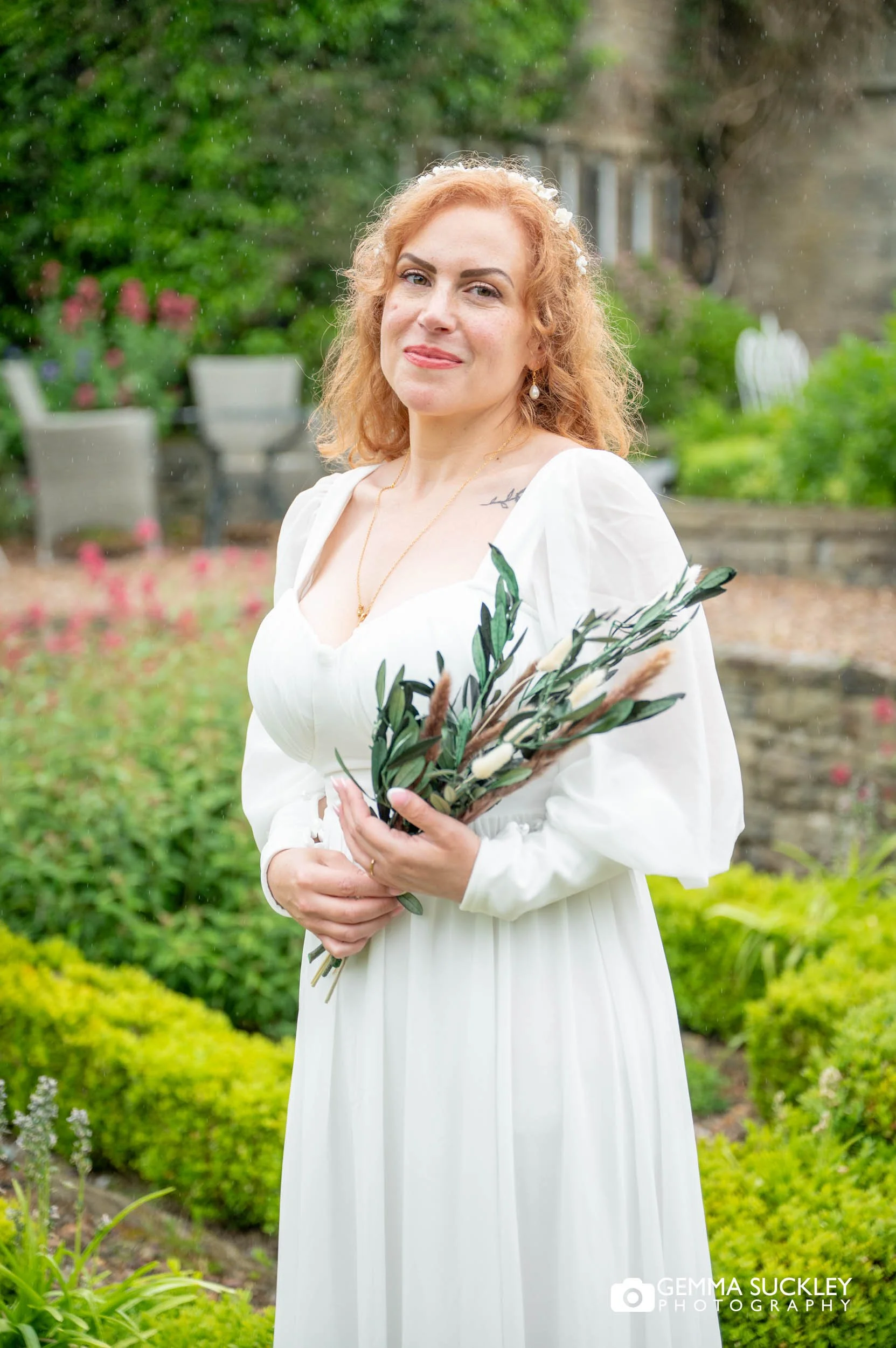 bride in the garden at holdsworth house