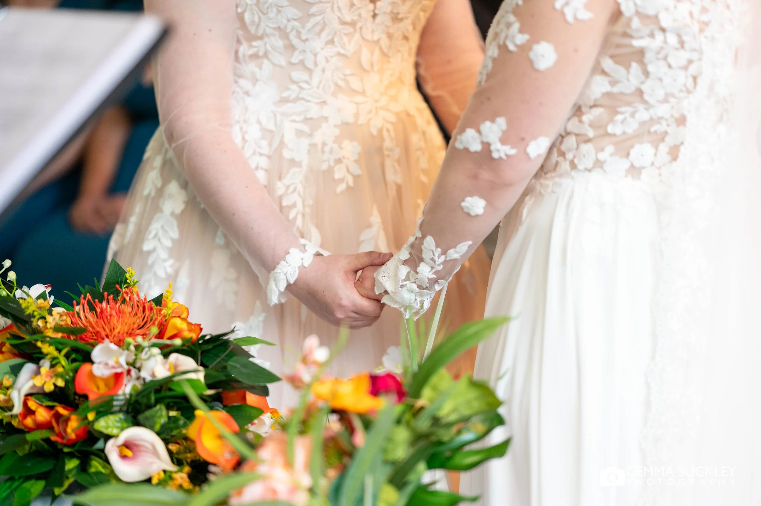 Rachel and Dagmara holding hands during their ceremony