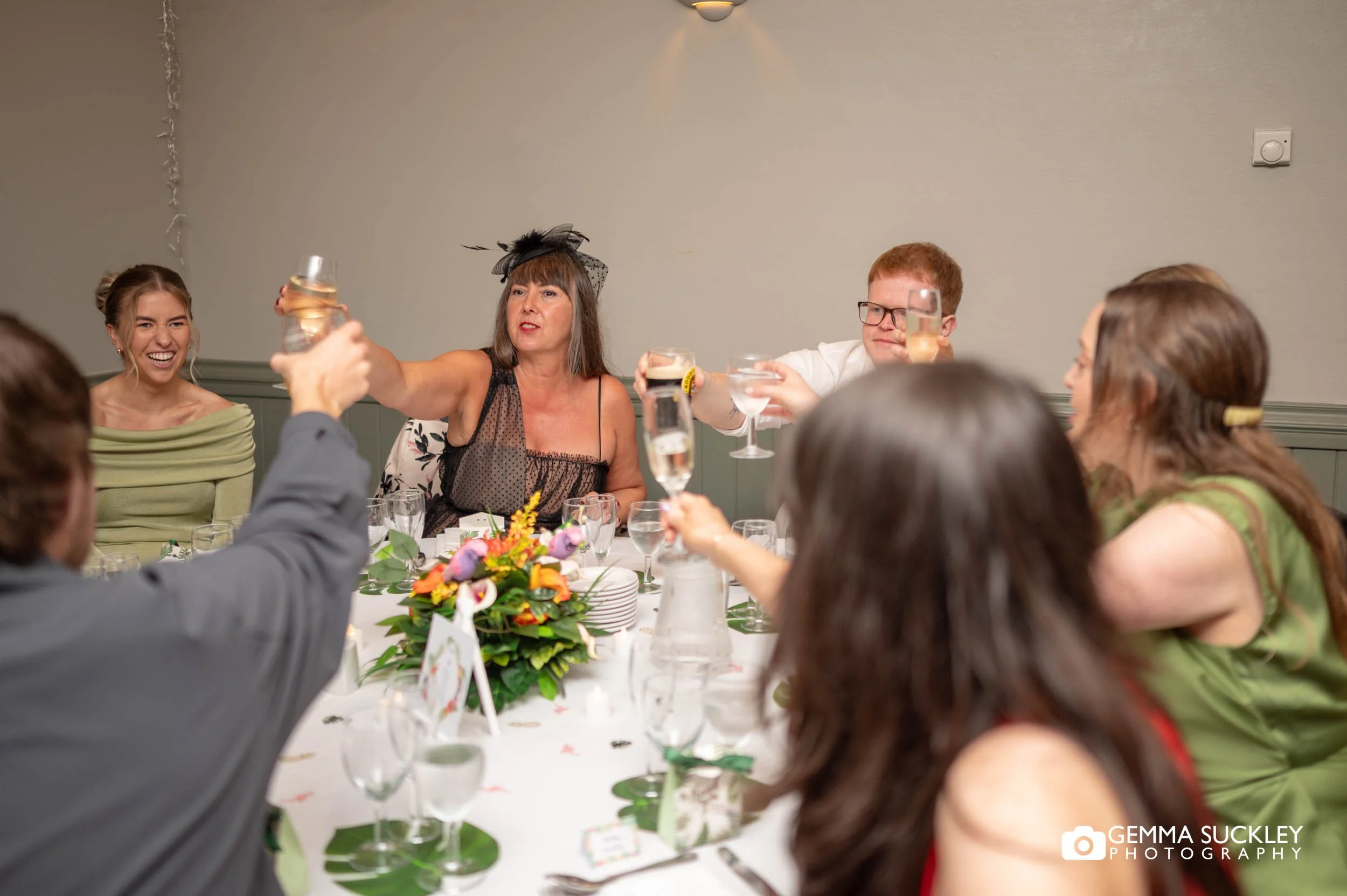 Guests laughing during the wedding breakfast speeches