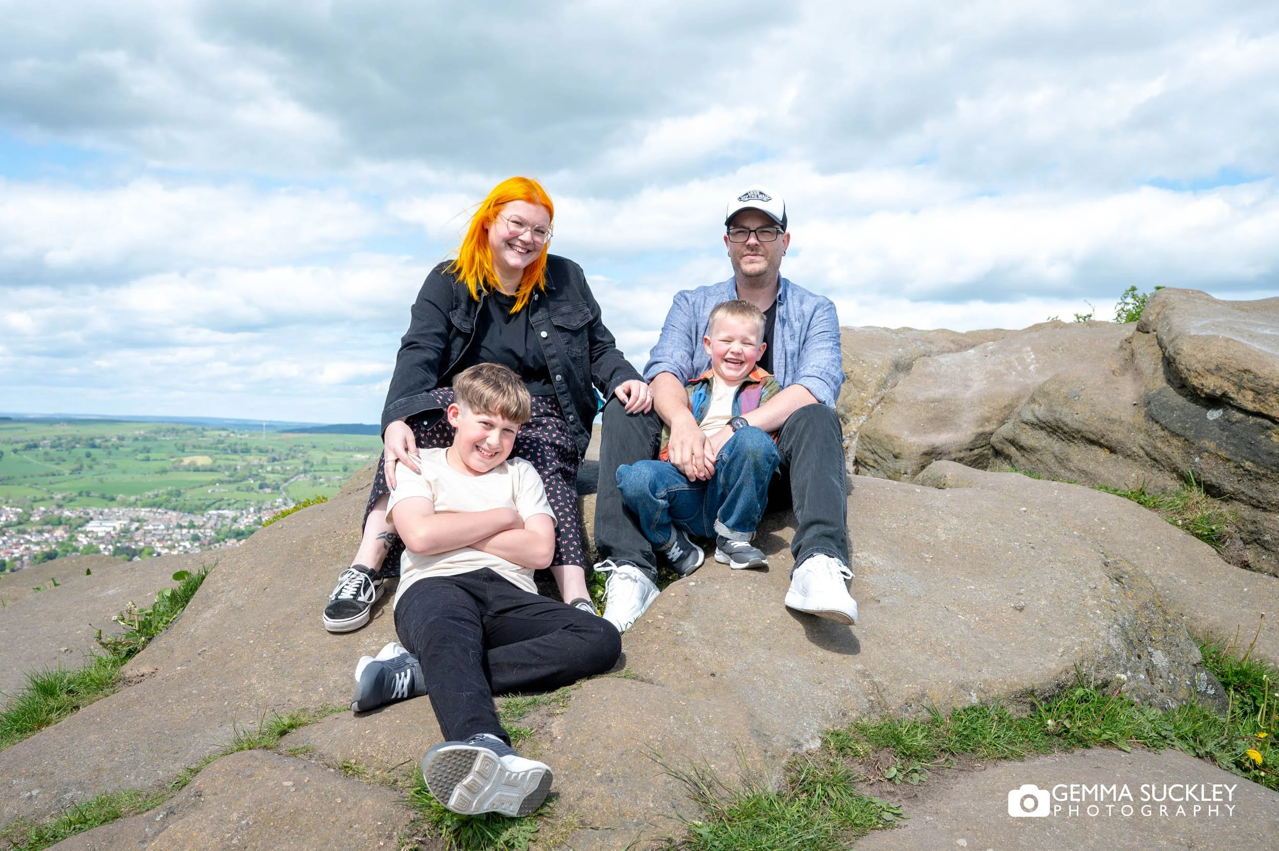 Family cuddling together at surprise view in otley