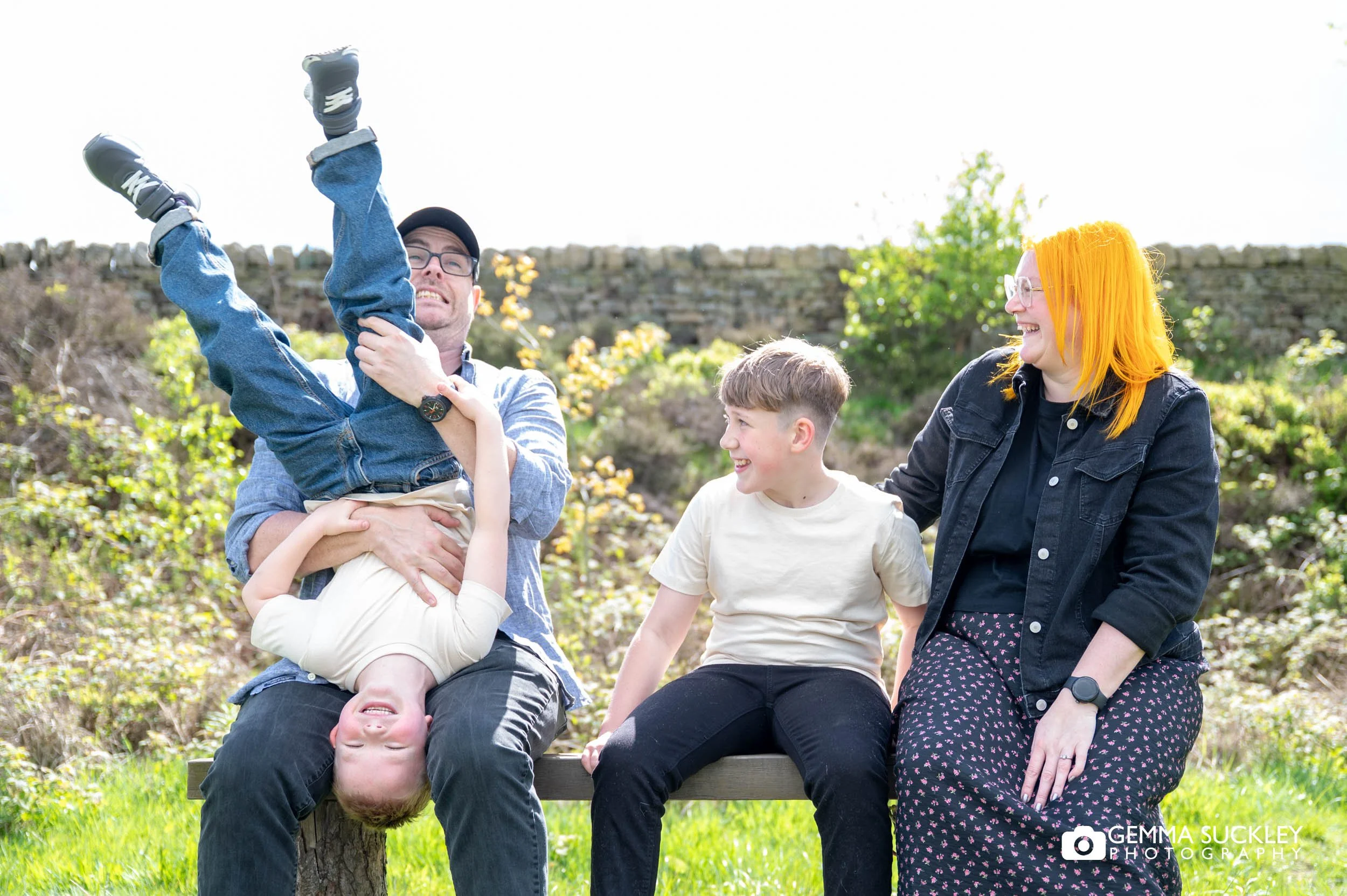 Family laughing together during an engagement shoot