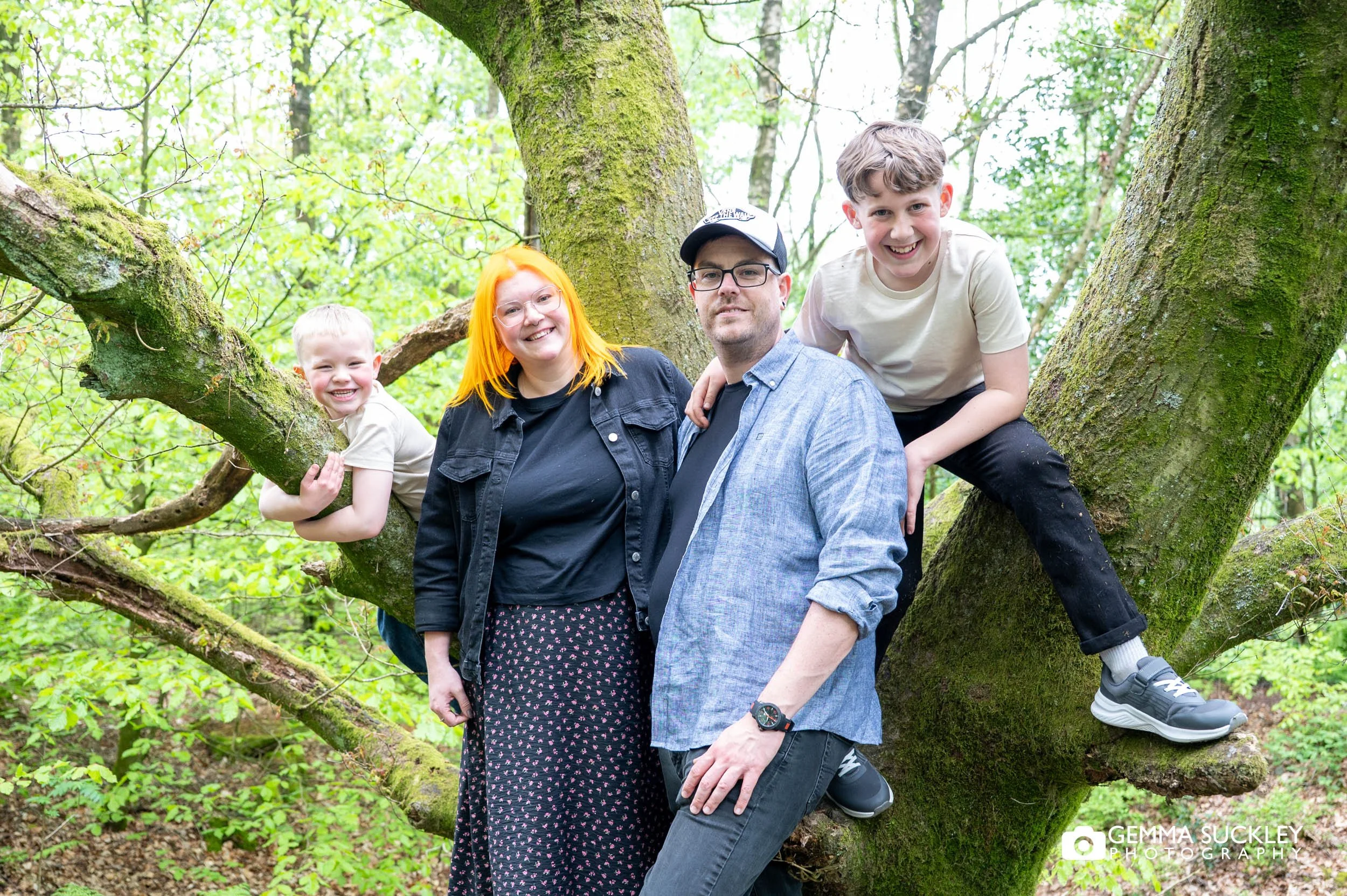 family smiling together in otley chevin woodland