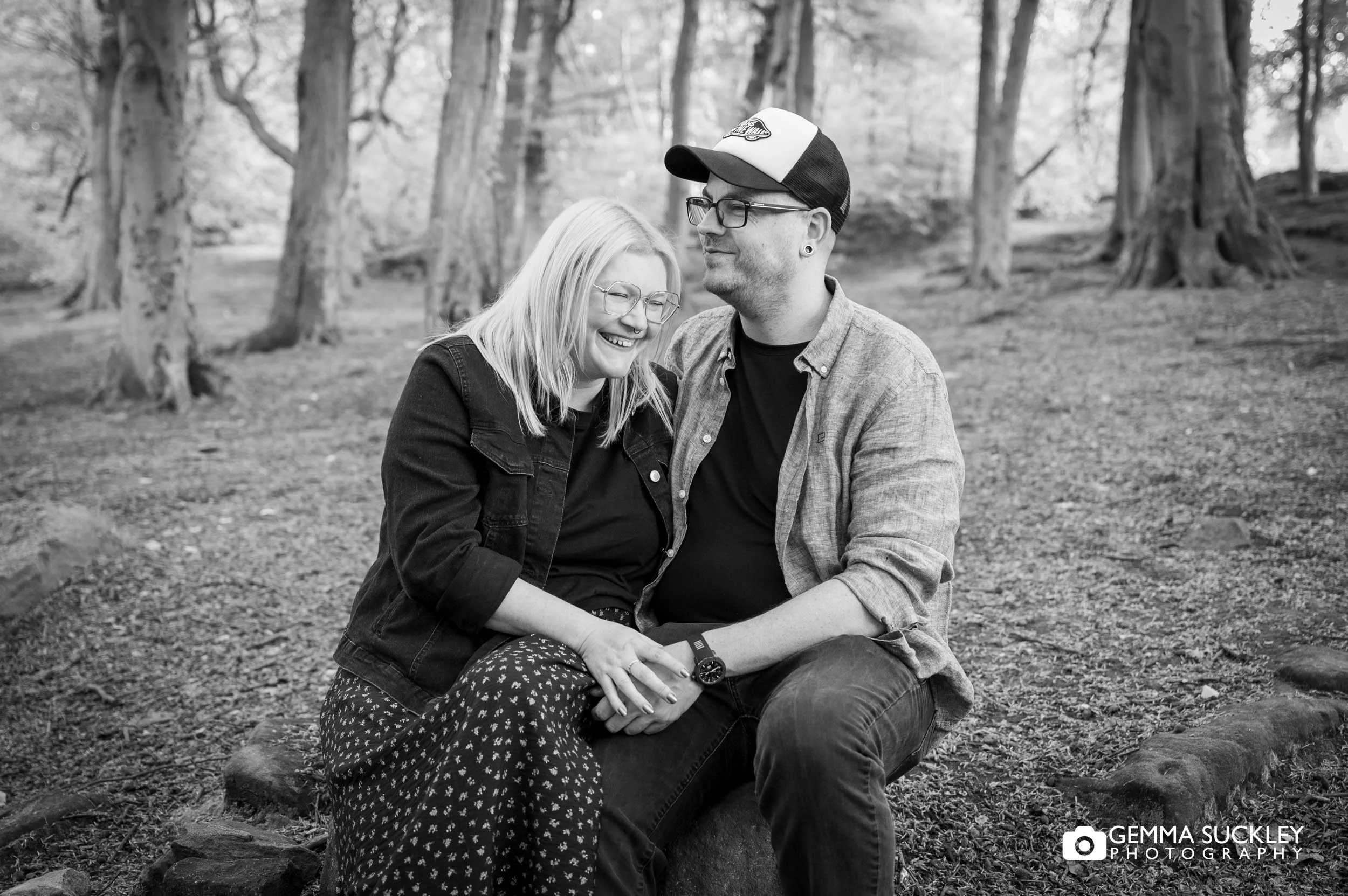 Candid laughter between the engaged alt couple