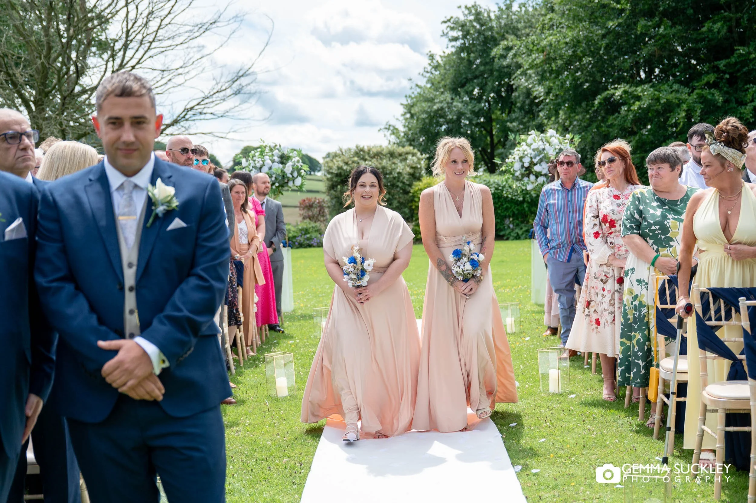 bridesmaids walking down the aisle 