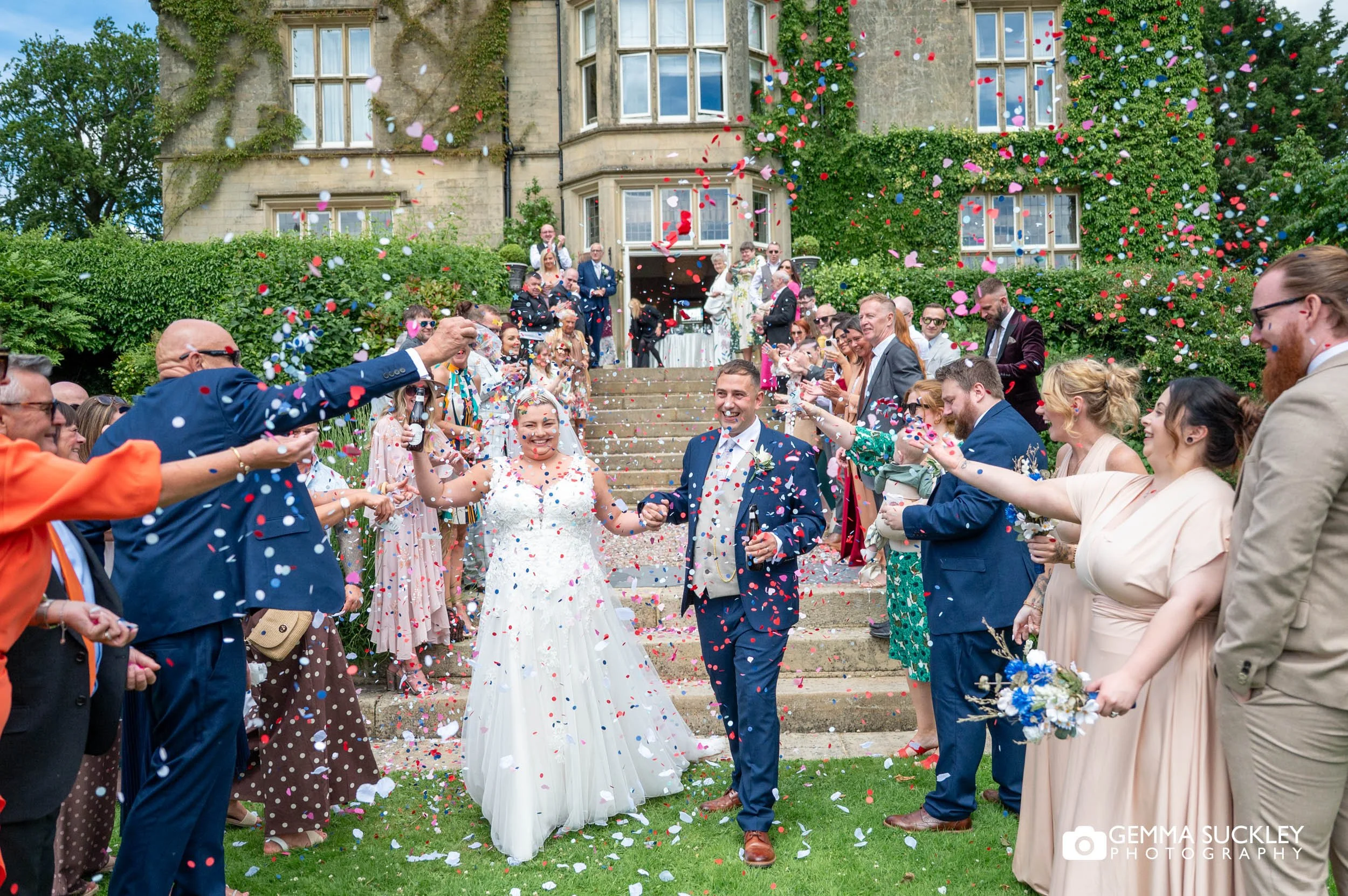 Guests throwing confetti outside Falcon Manor