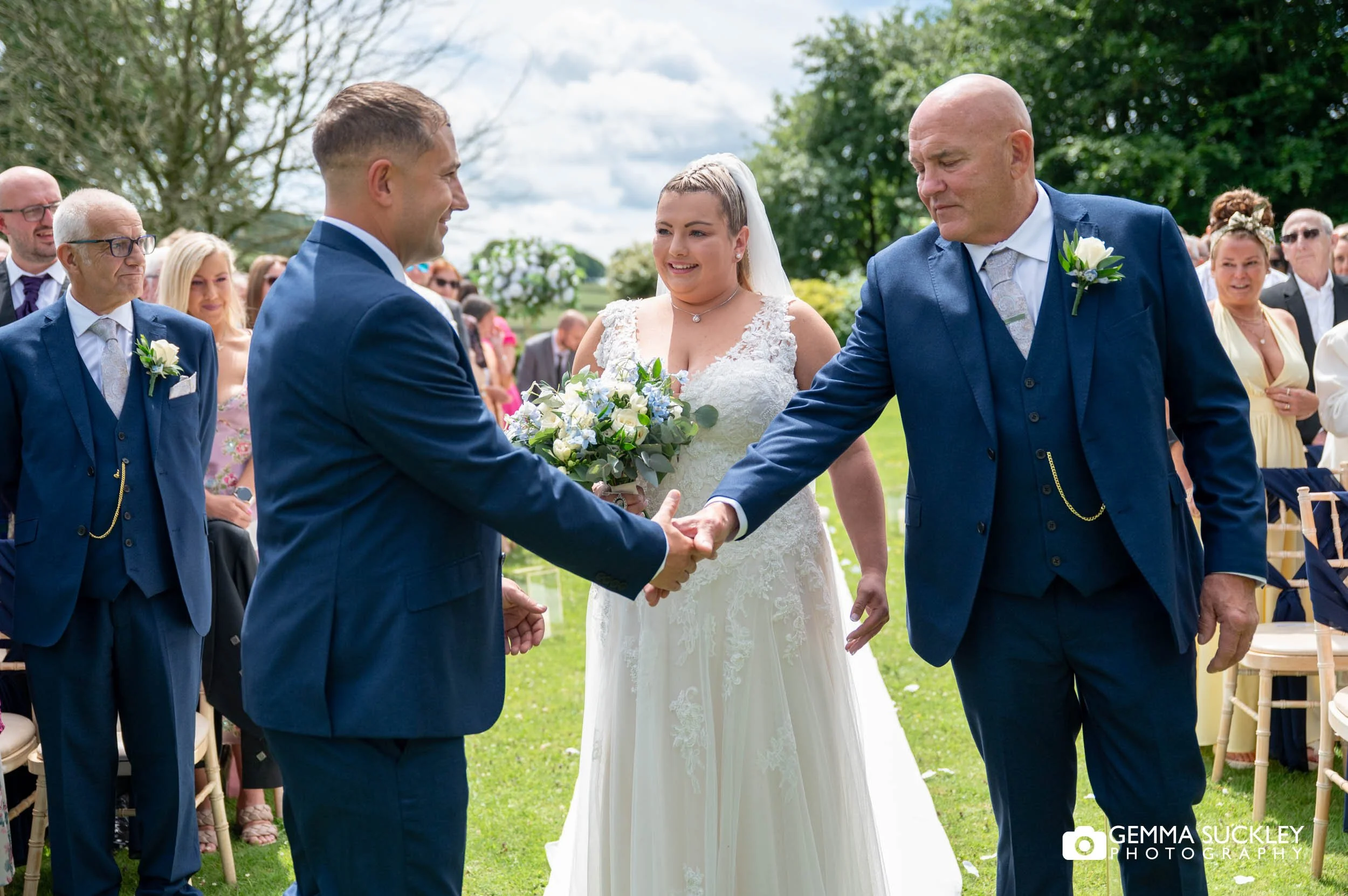 groom and father of the bride shaking hands