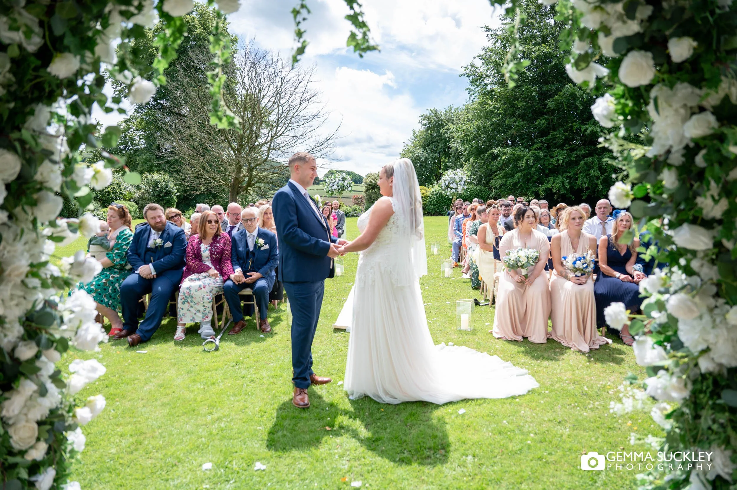 Bride and groom exchanging rings