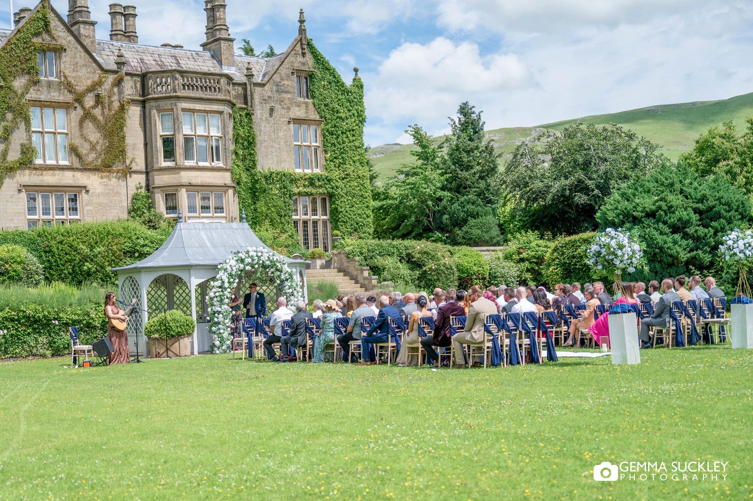 guests seated outside the falcon manor ready for the ceremony 