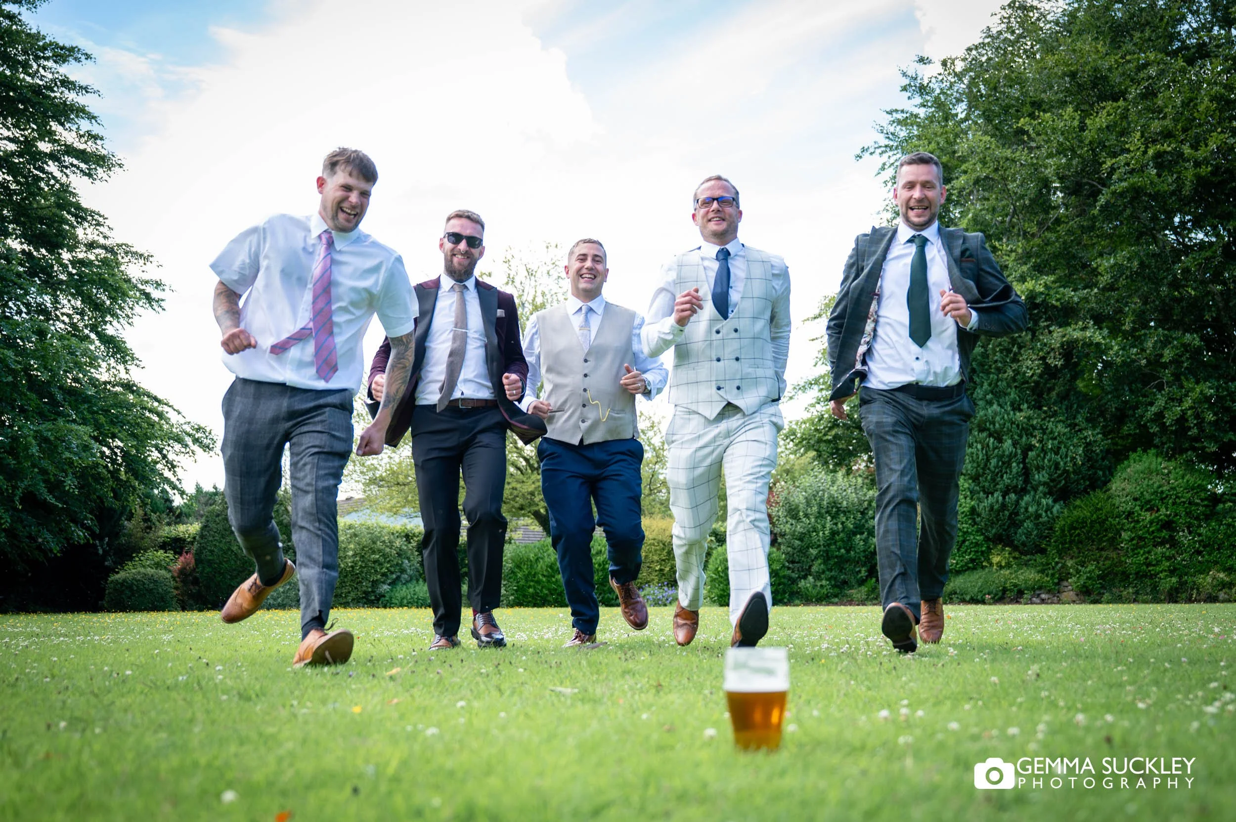 grooms party running to pick up the beer