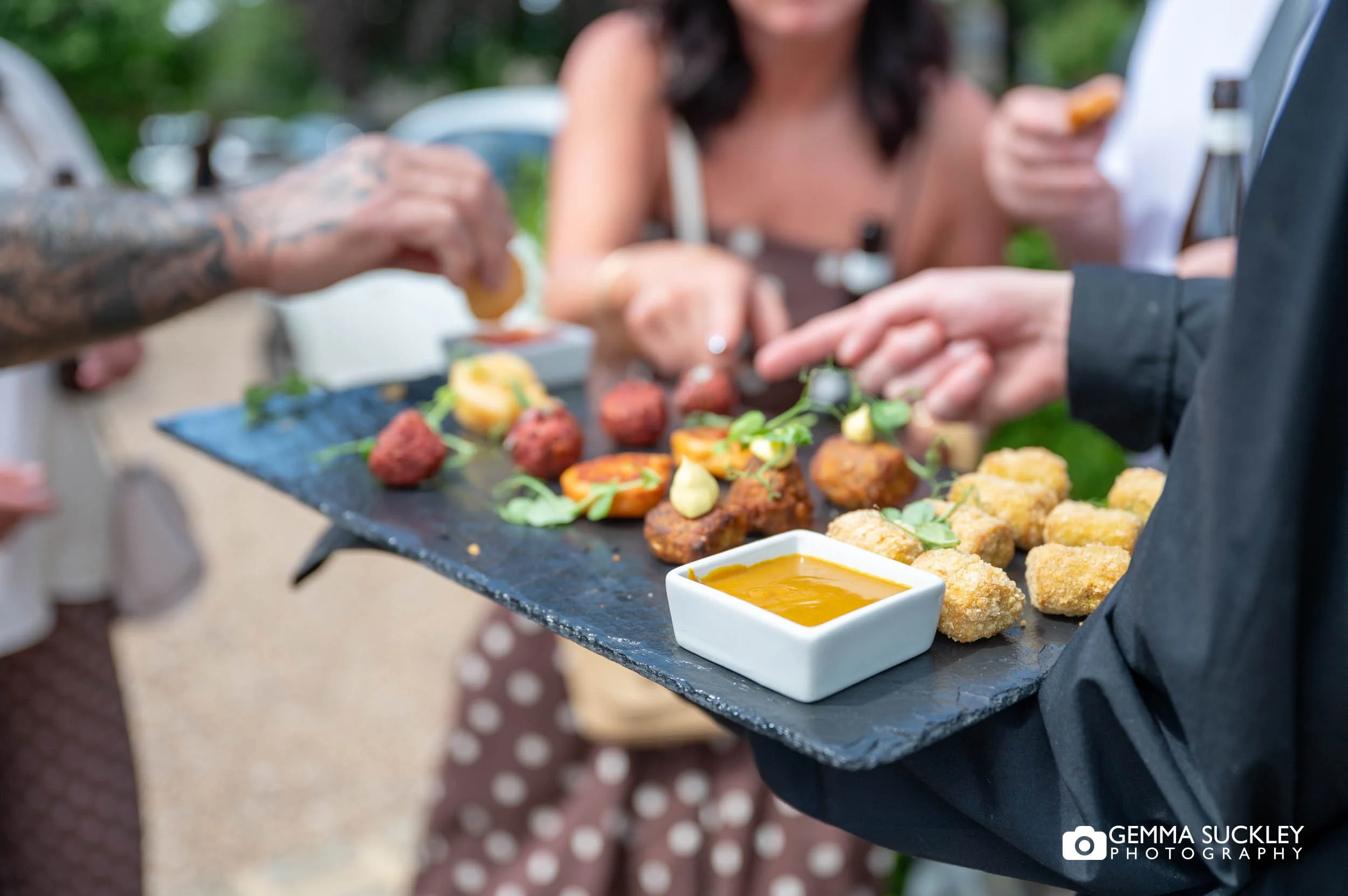 canapes being offered to wedding guests