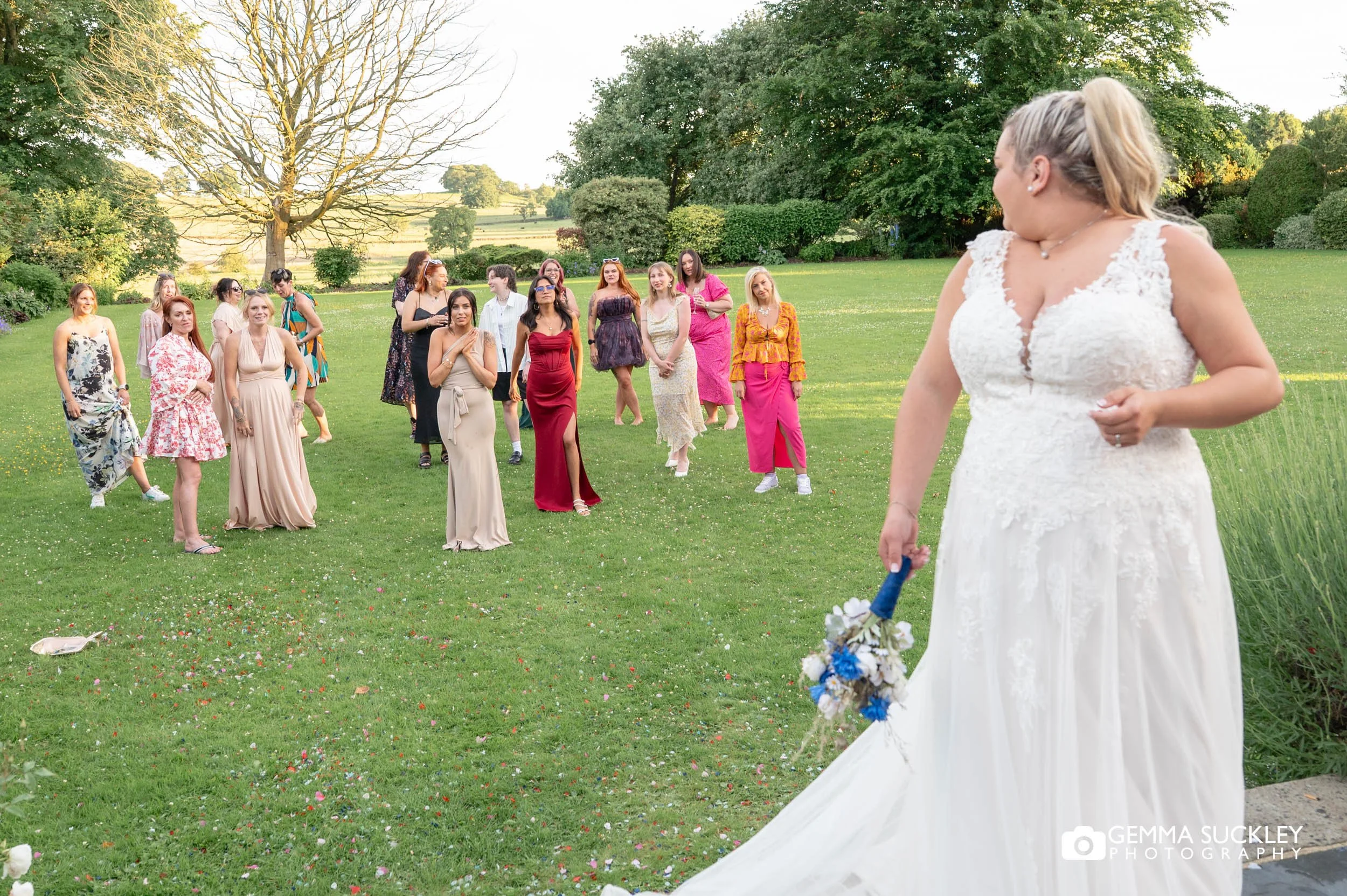 bride getting ready to throw her bouquet 