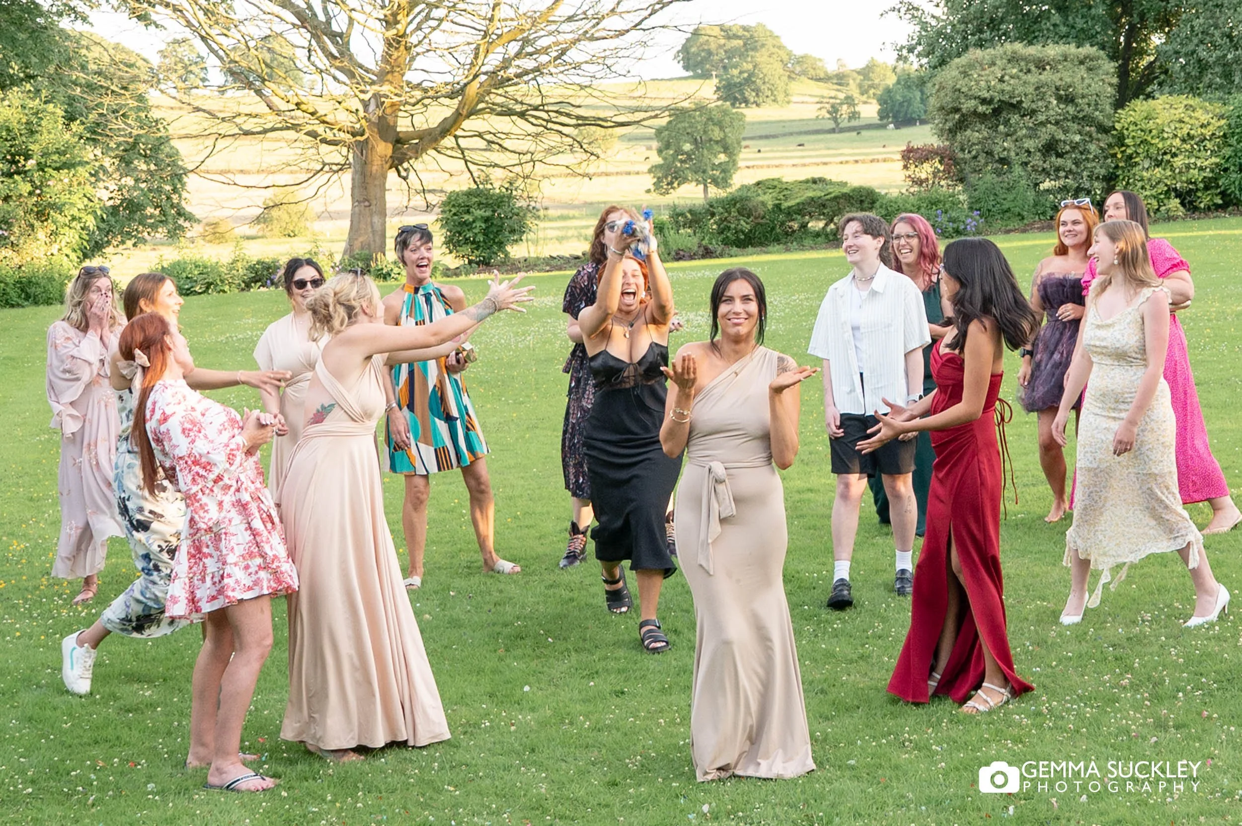 wedding guest catching the bouquet  