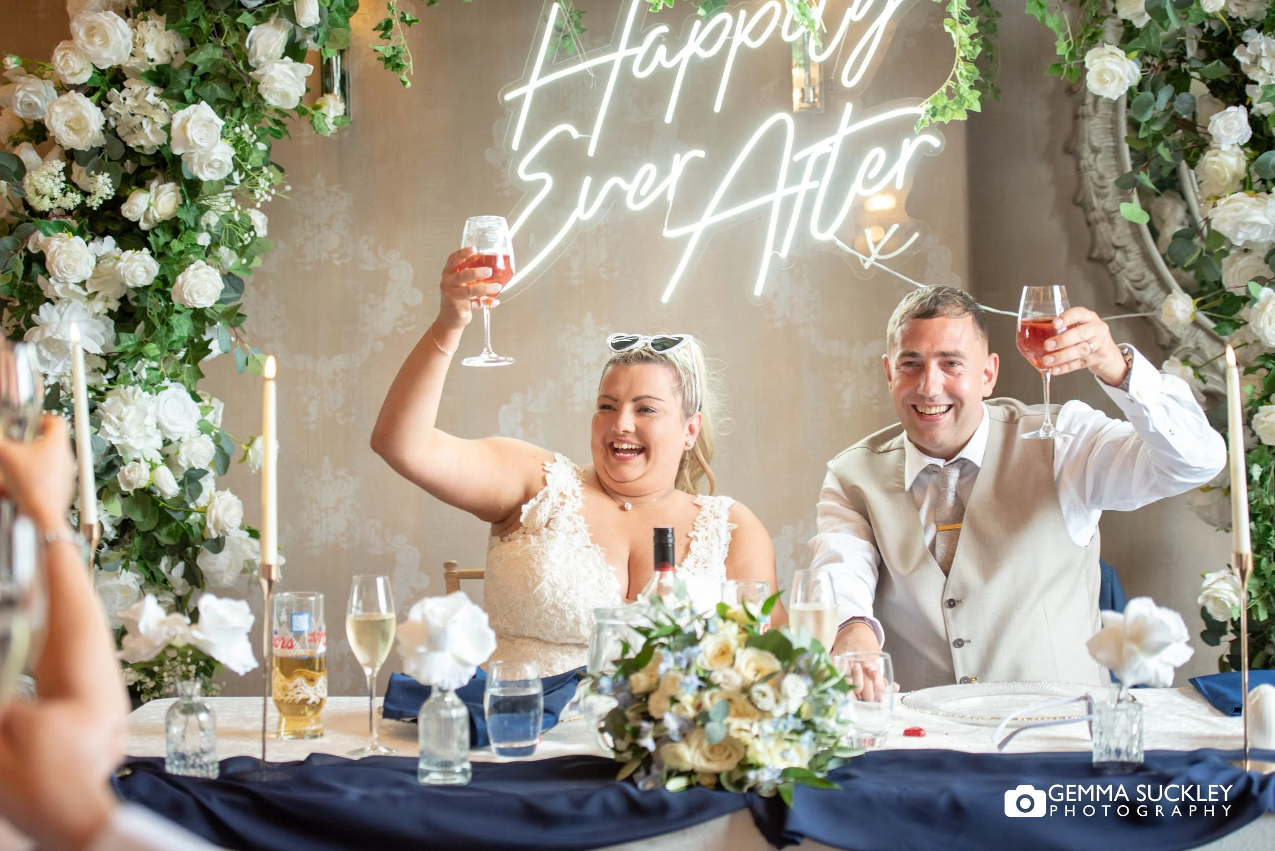 Bride and groom cheering during the speeches.