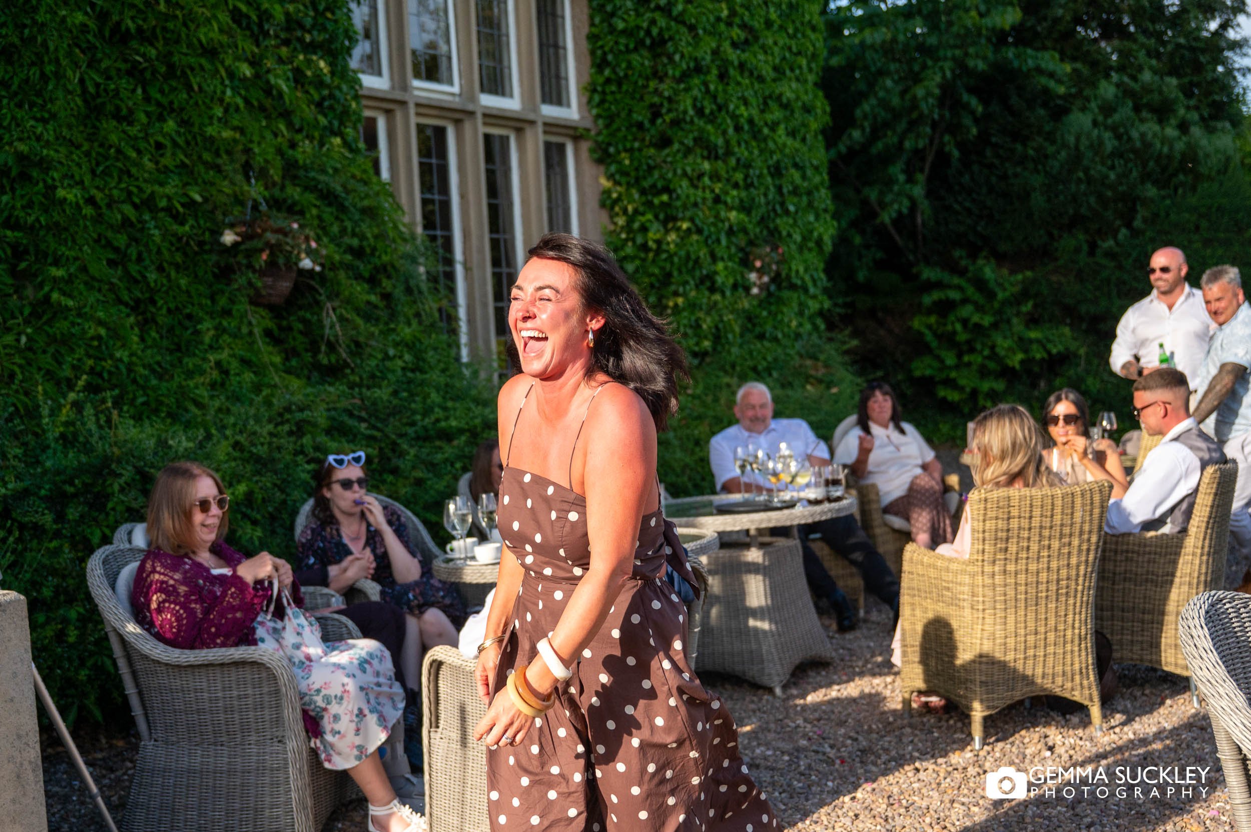 Guests laughing together during the reception