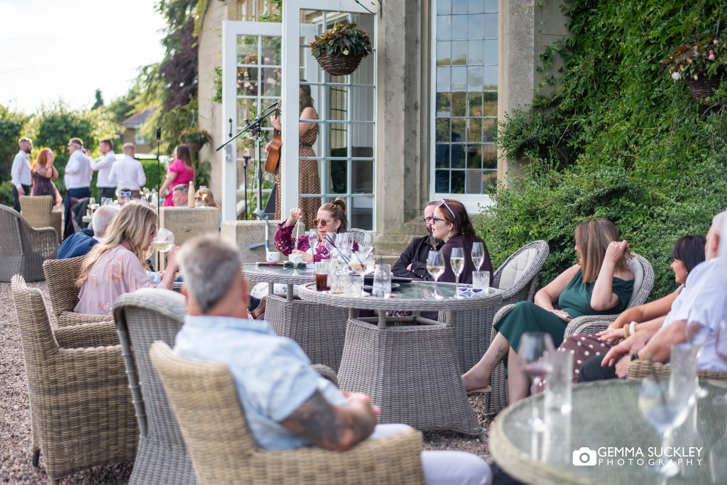 Guests chatting during the summer drinks reception
