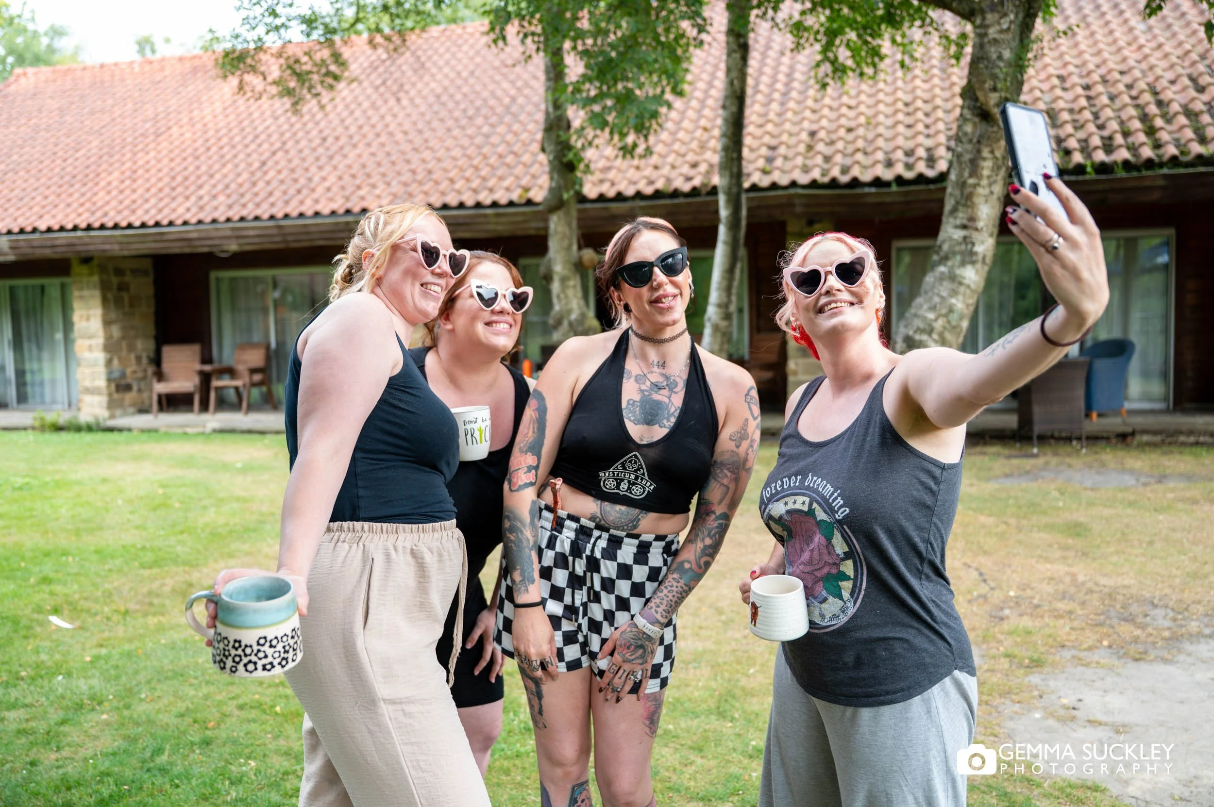 bridesmaids taking a selfie outside the chevin hotel