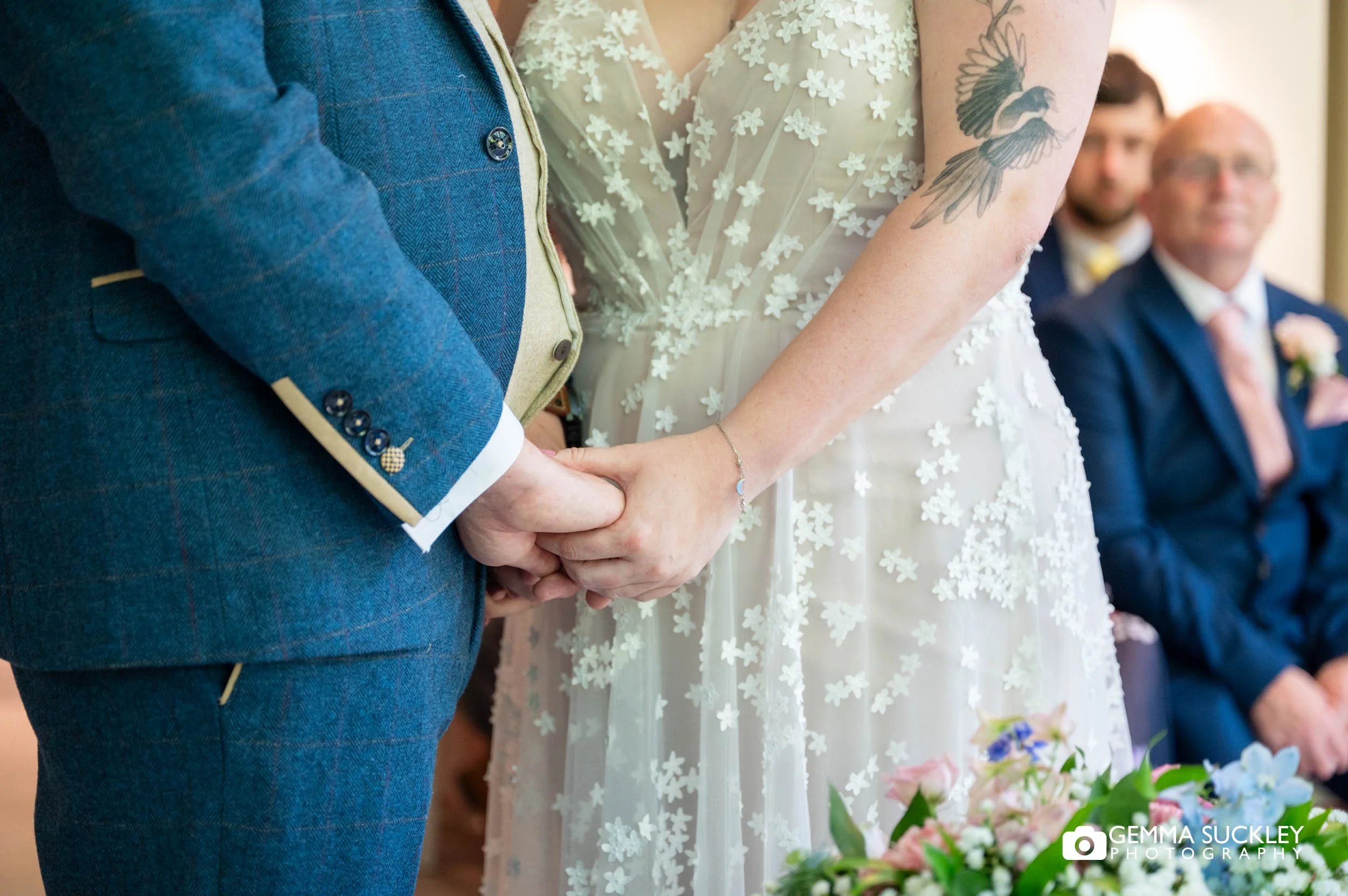 bride and groom holding hands