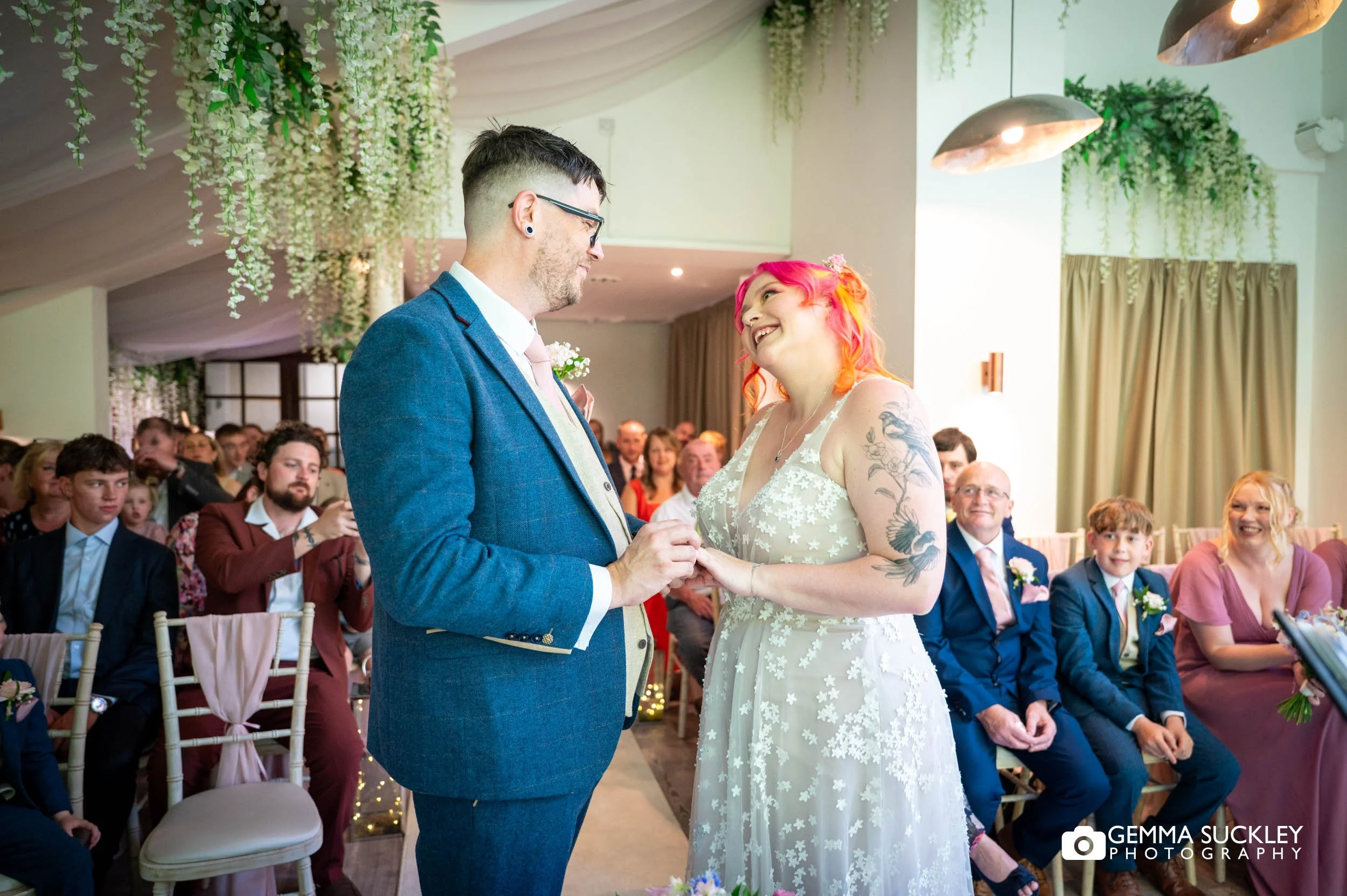 Couple exchanging vows during the ceremony.