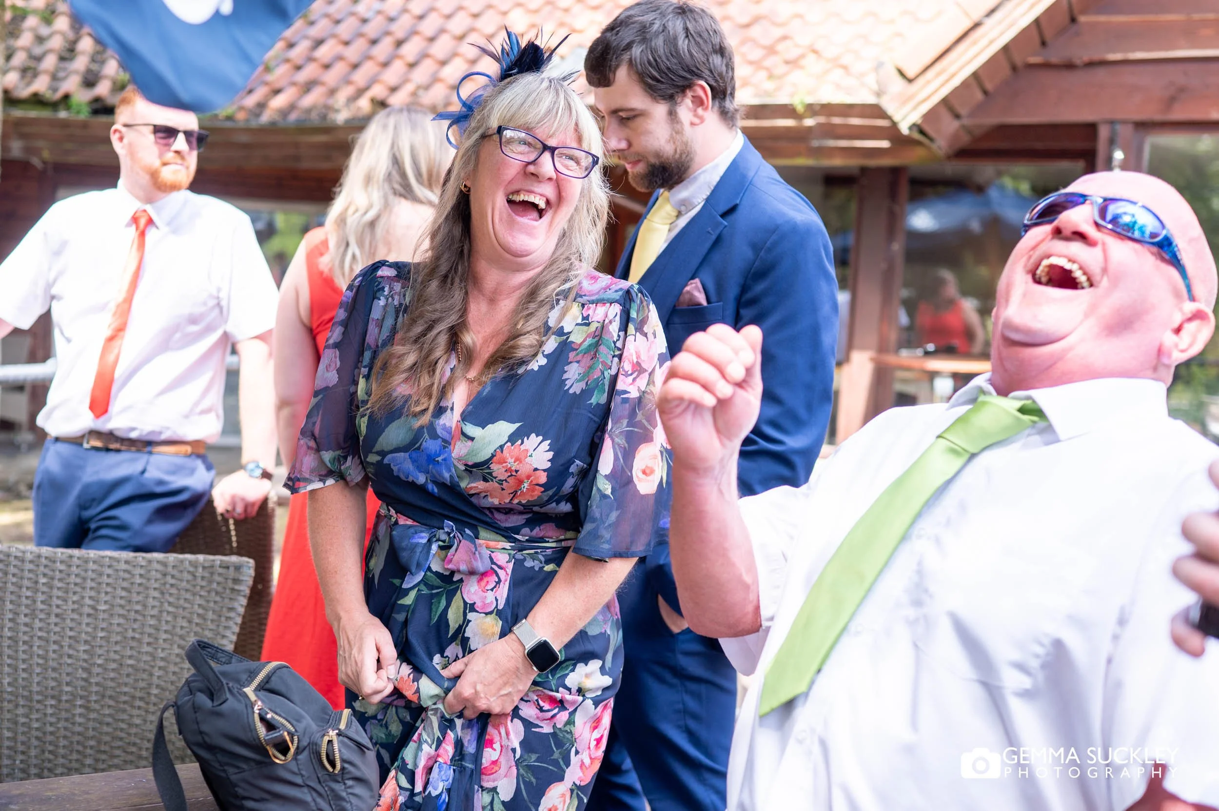 wedding guests laughing