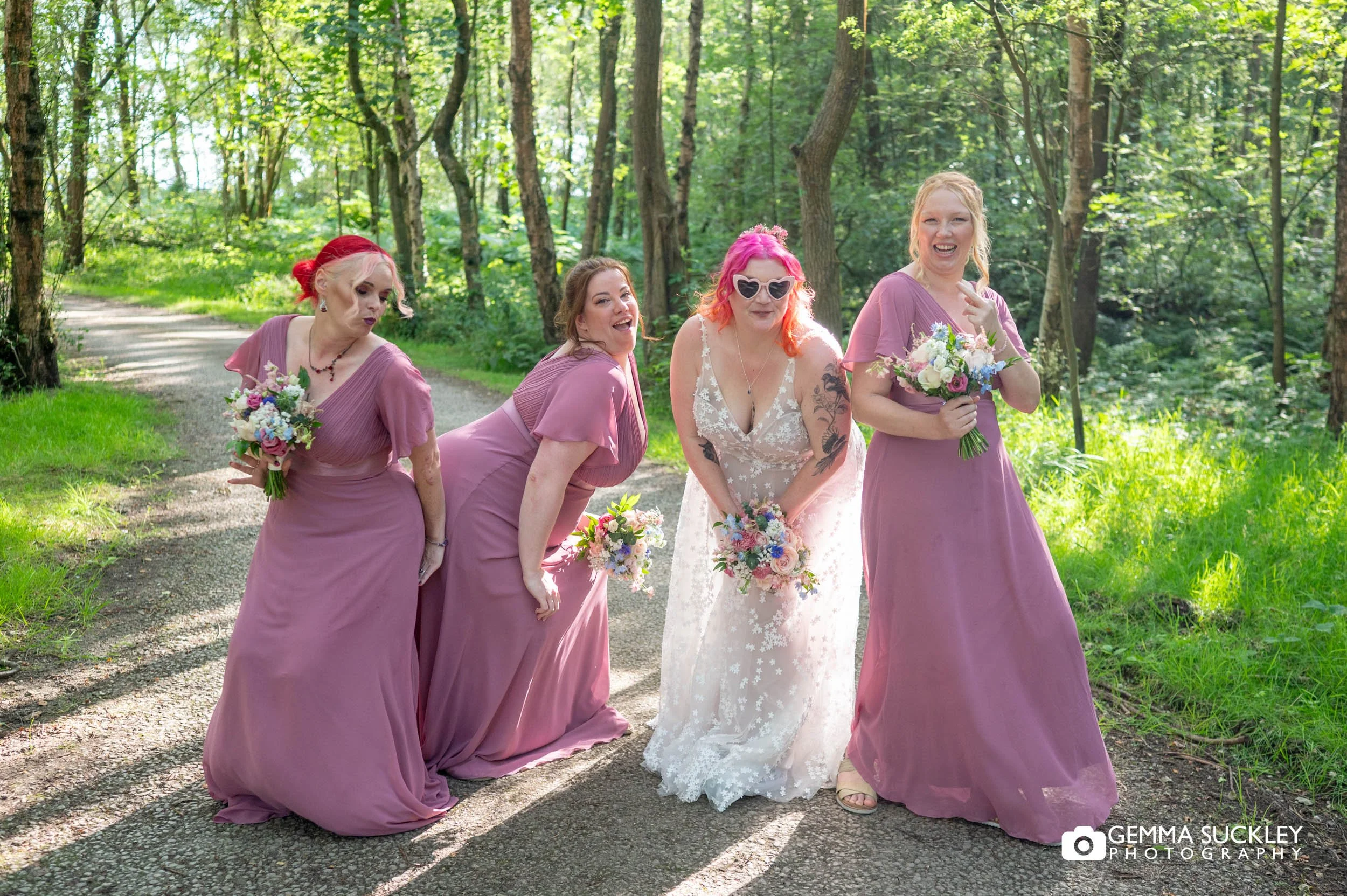 Wedding party laughing during group portraits