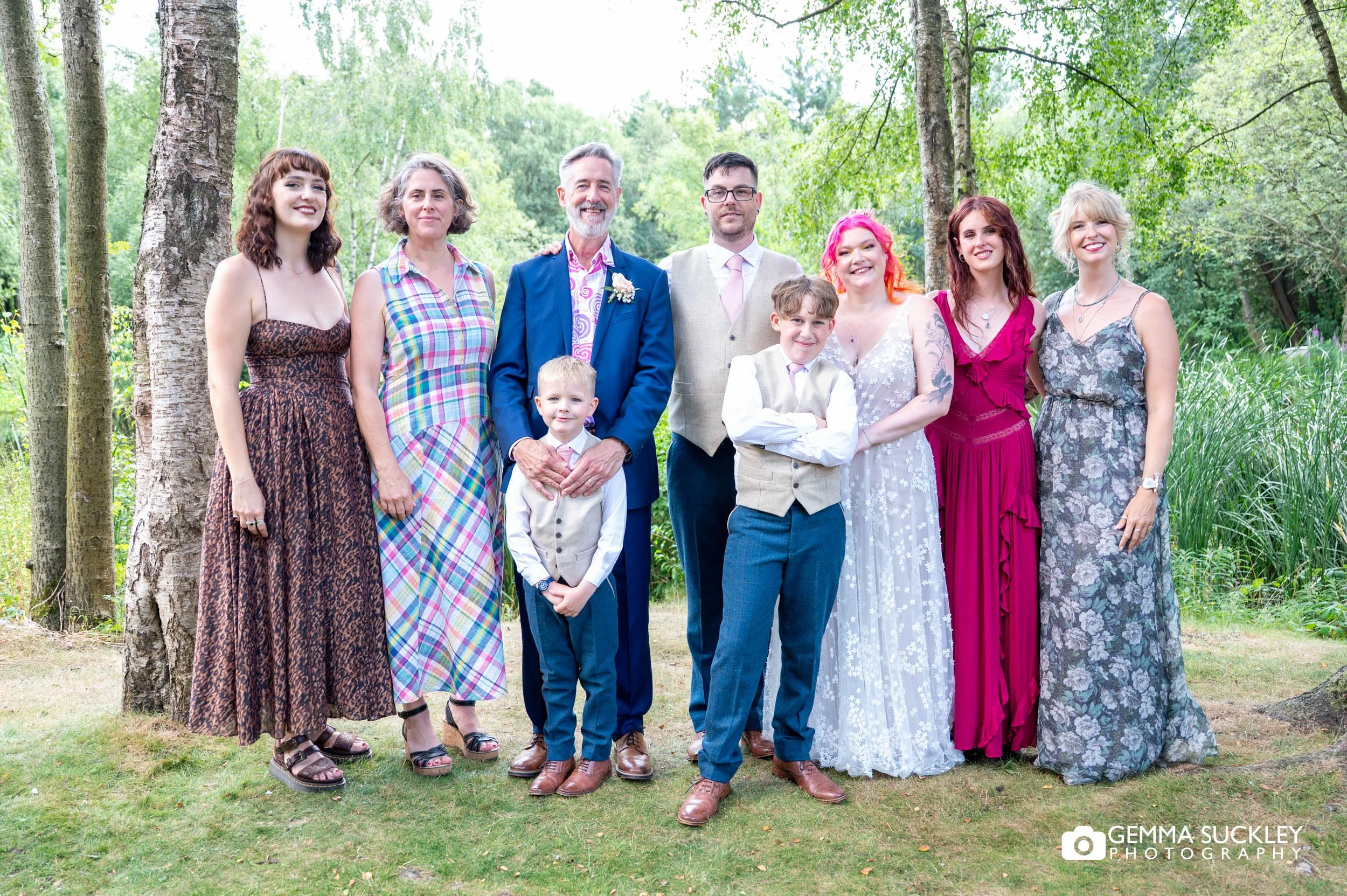 Newlyweds surrounded by their families