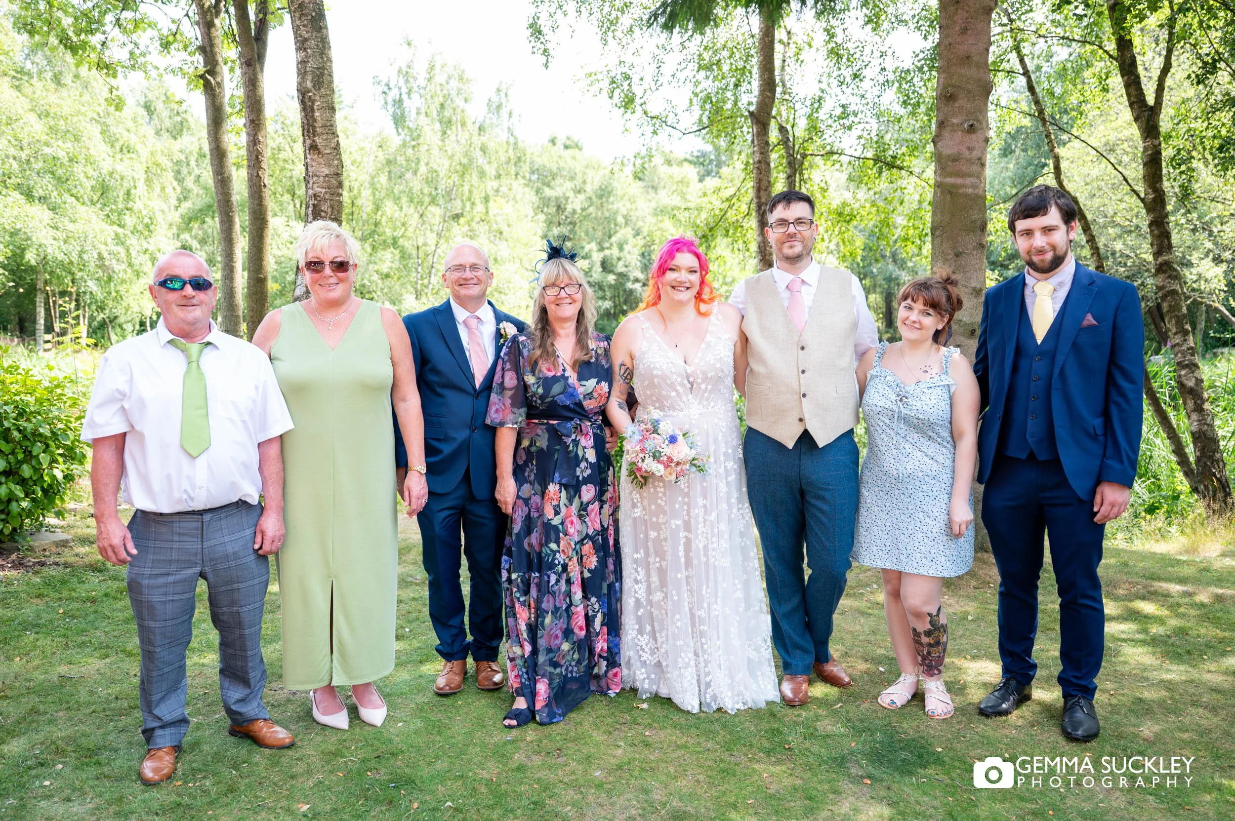 Couple with their extended family outside the venue