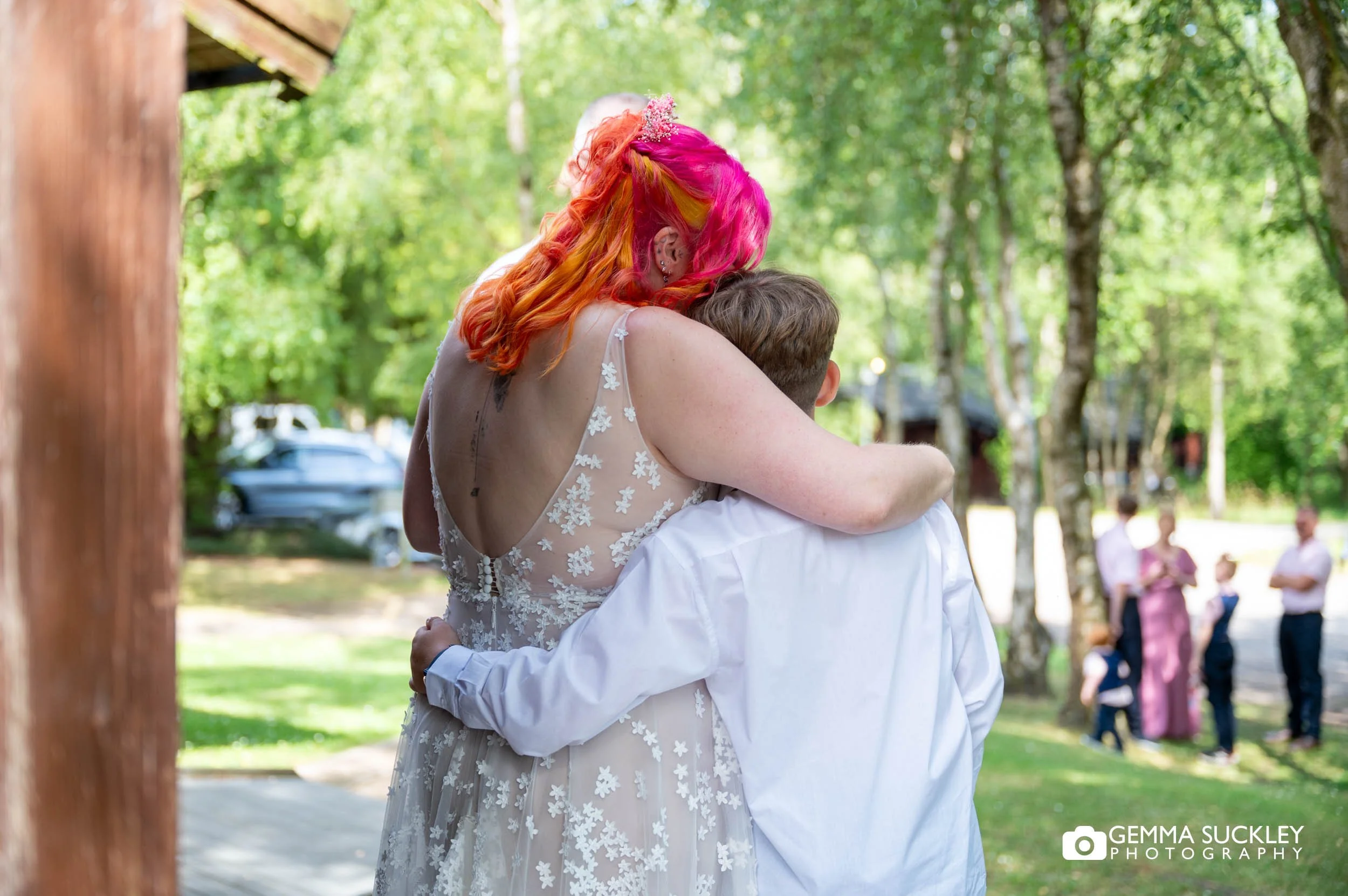 bride hugging her son