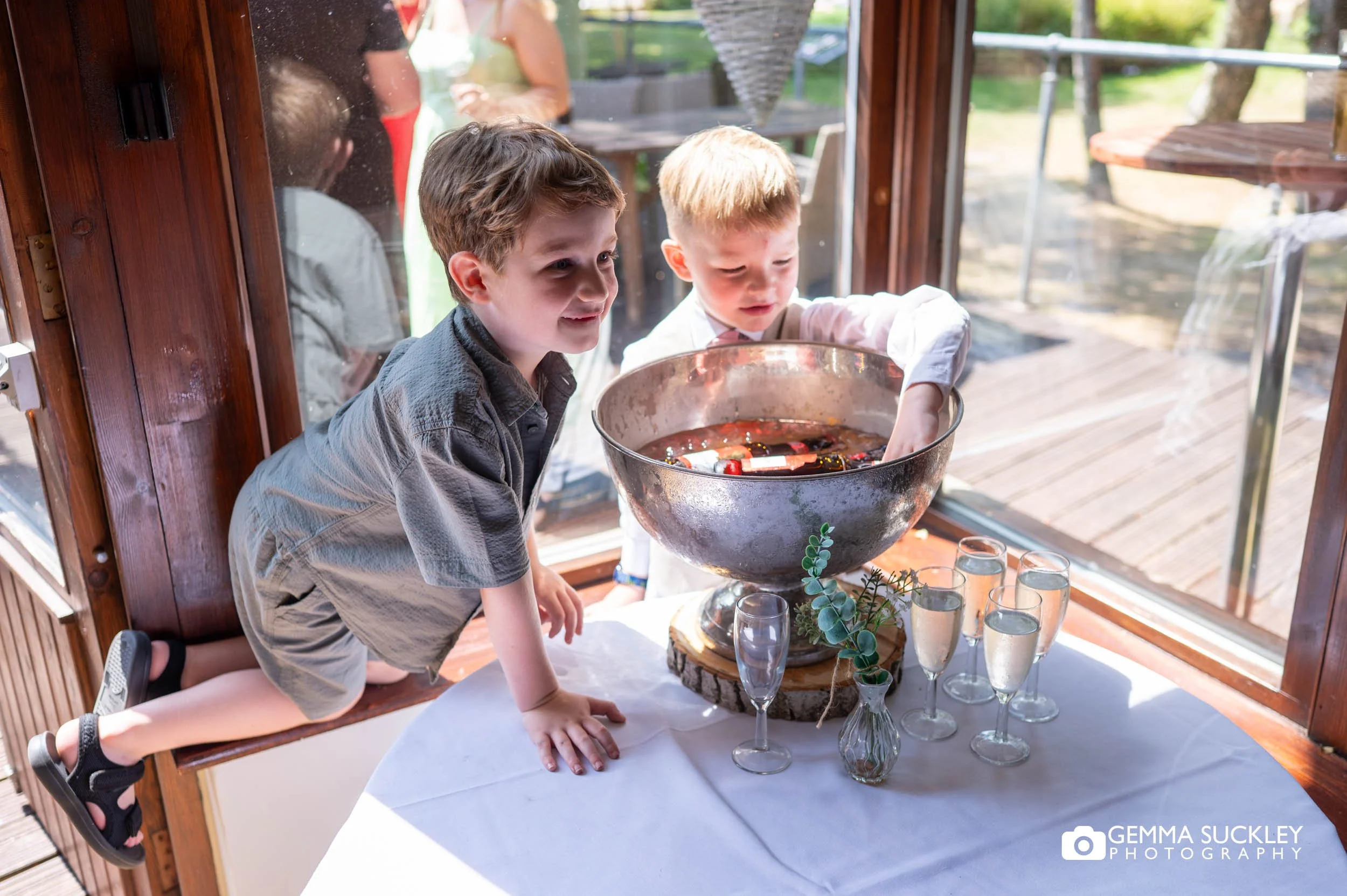 kids taking ice for the cooler 