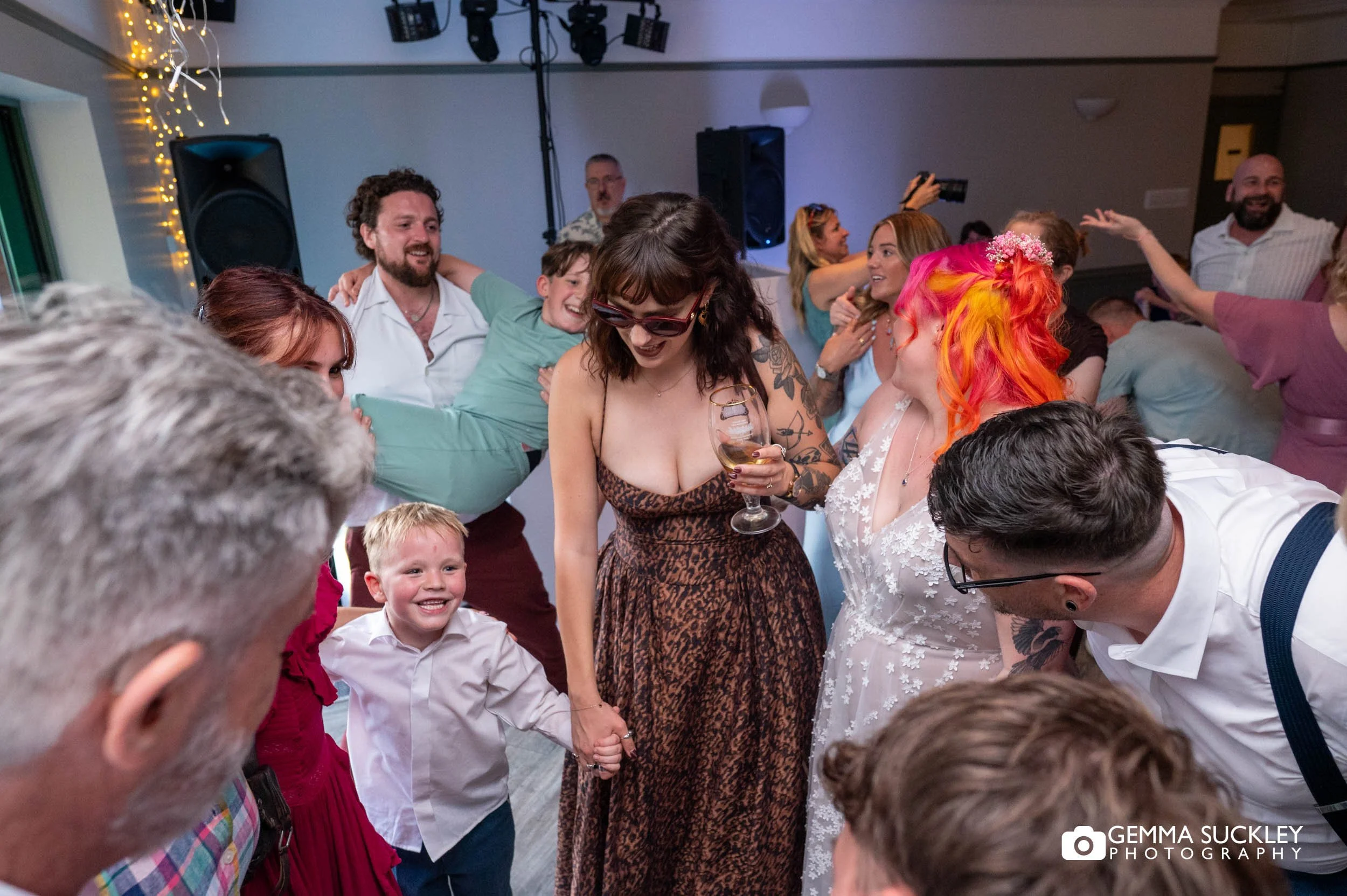 Friends and family celebrating together on the dance floor