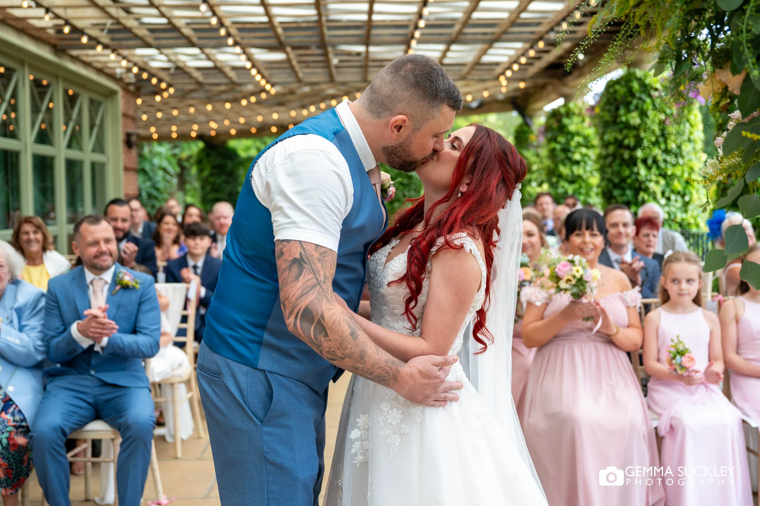 bride and groom kissing after the ceremony