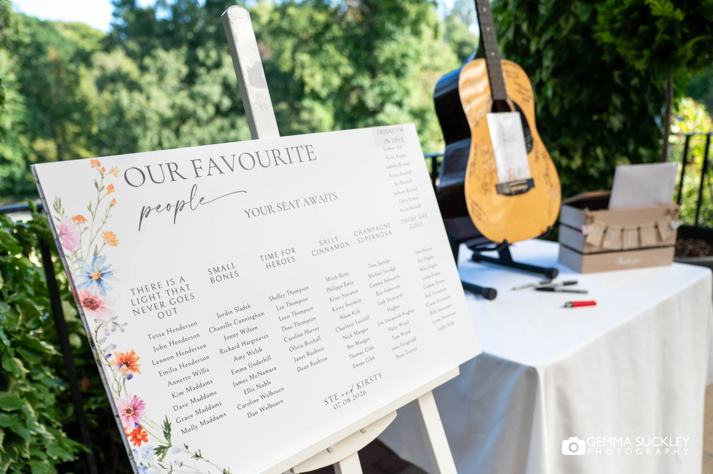 Wedding table plan featuring song lyrics