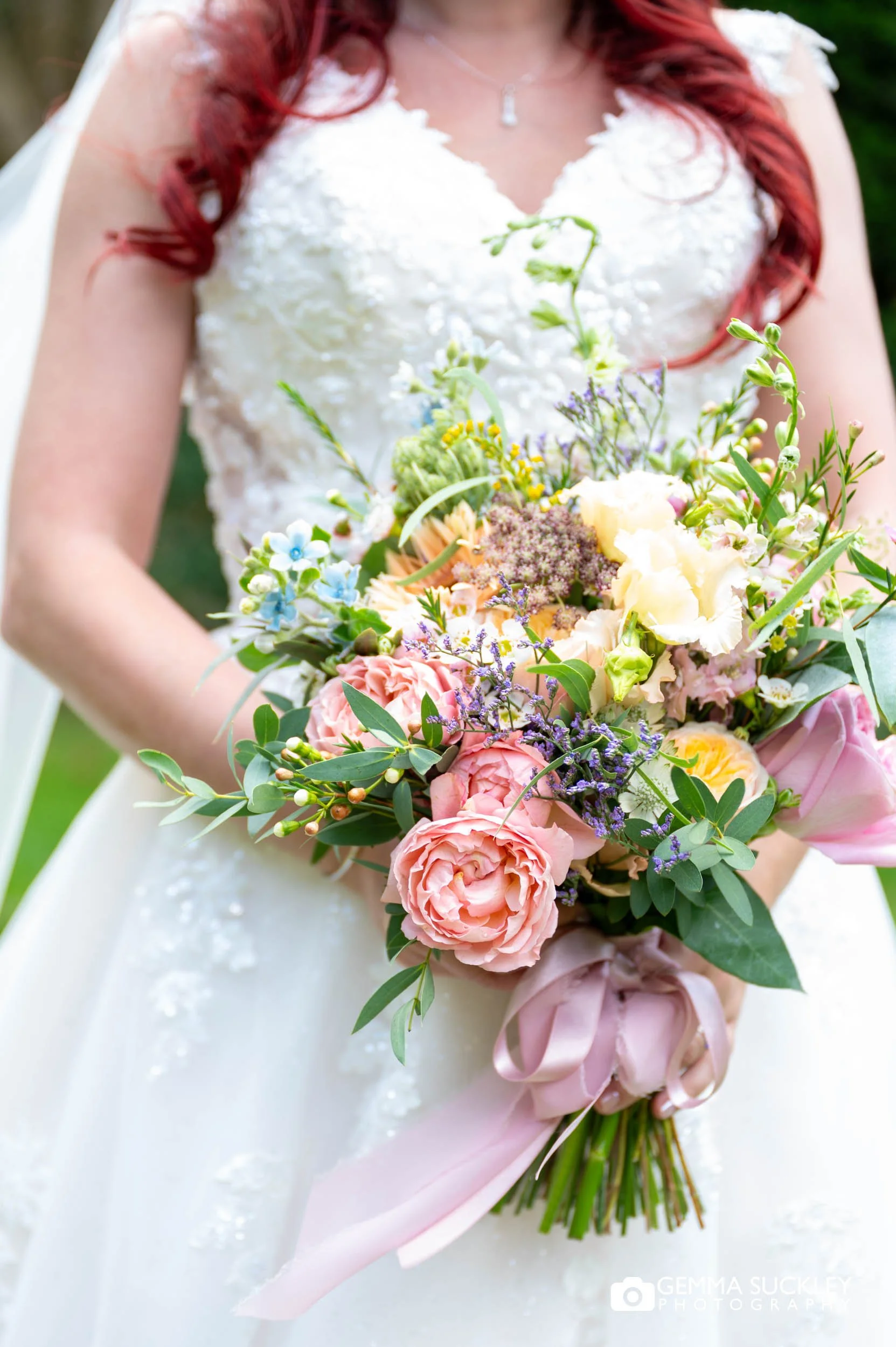 Wildflower wedding bouquet with pink and pastel flowers