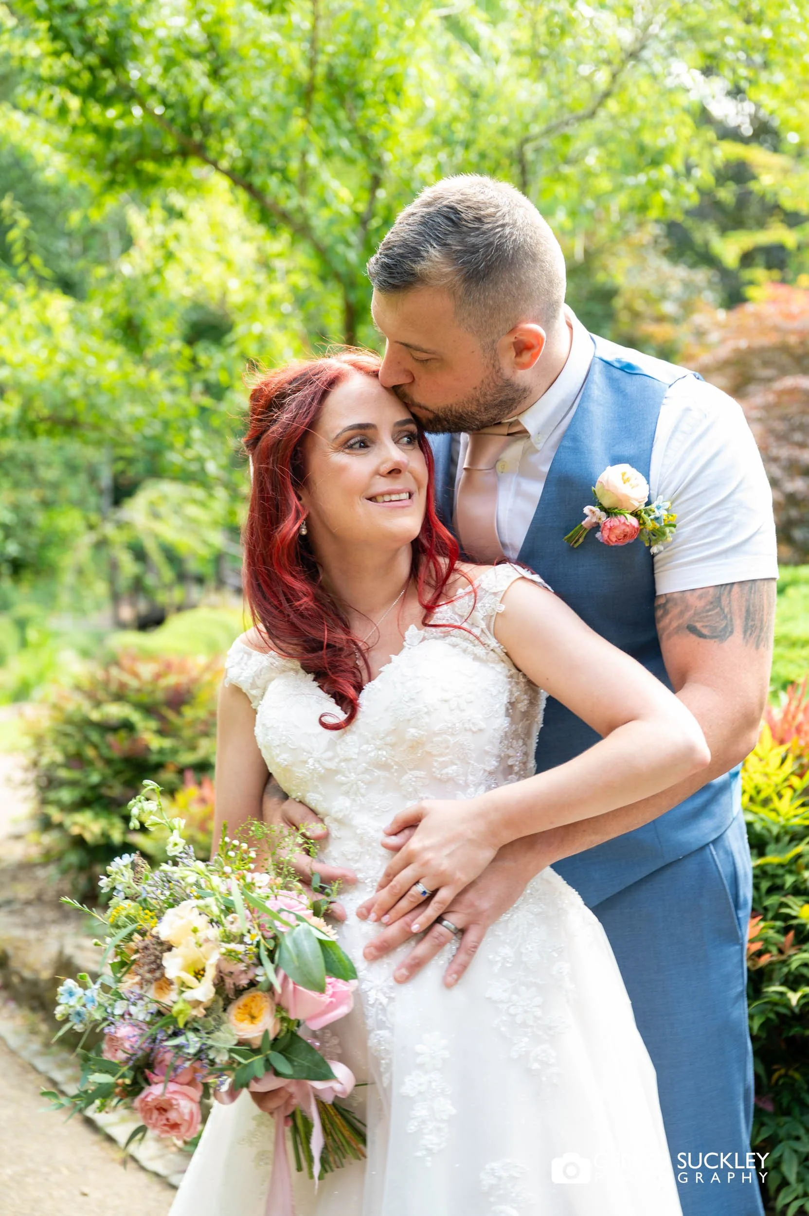 bride and groom hugging in valley gardens