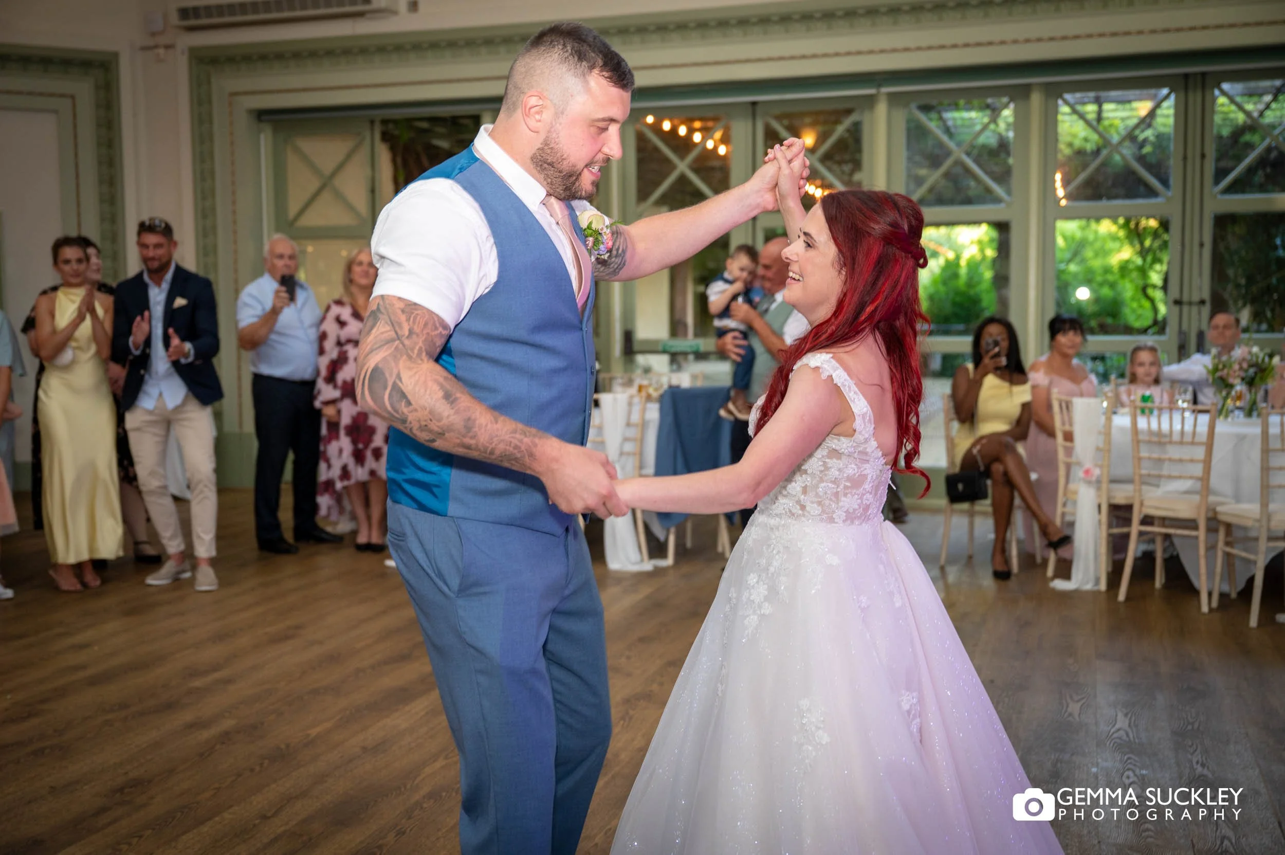 Bride and groom dancing to Friday I'm in Love by The Cure