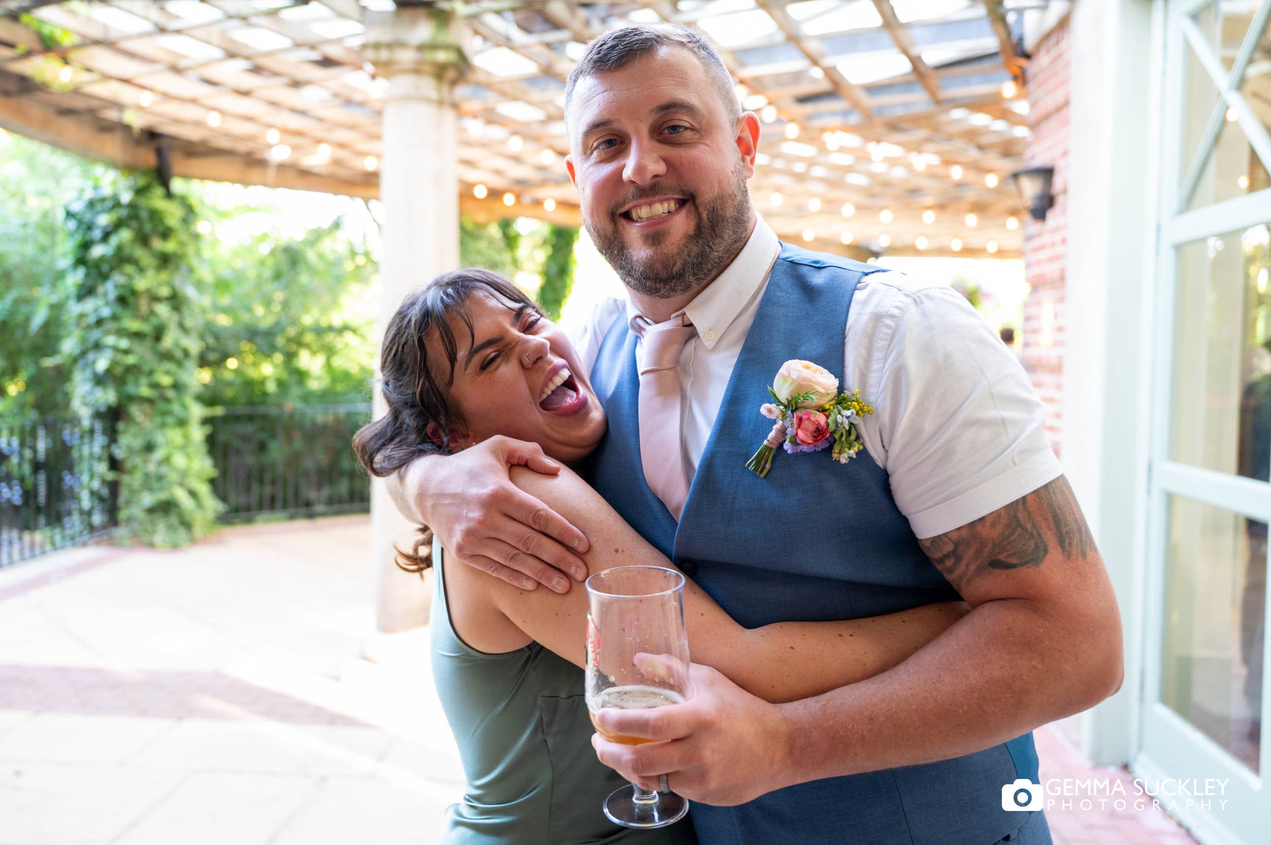 groom and his sister hugging