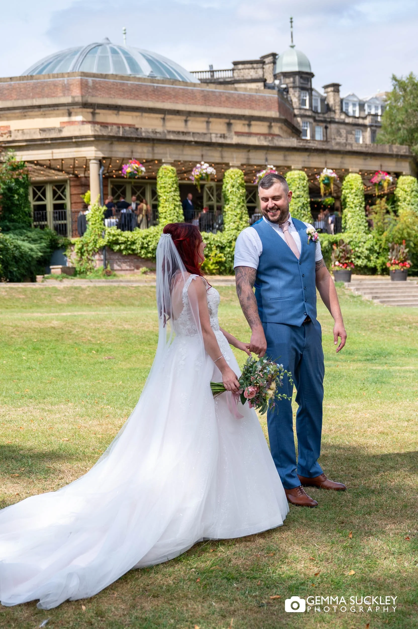 bride and groom in front of the sun pavilion