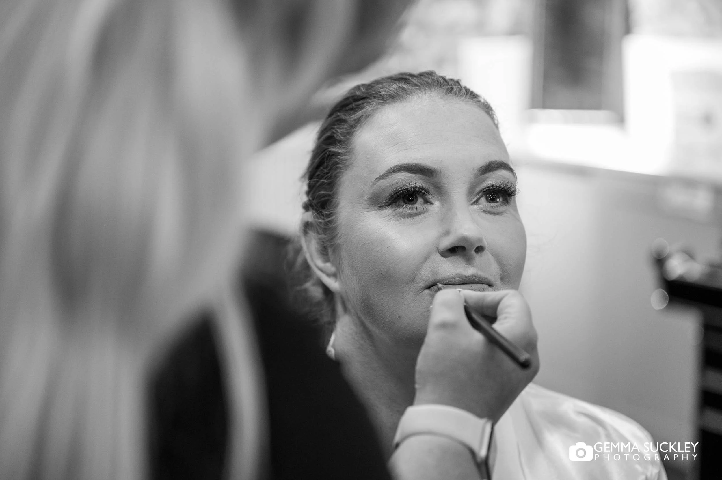 Bride having her hair and makeup done at The bunk barn