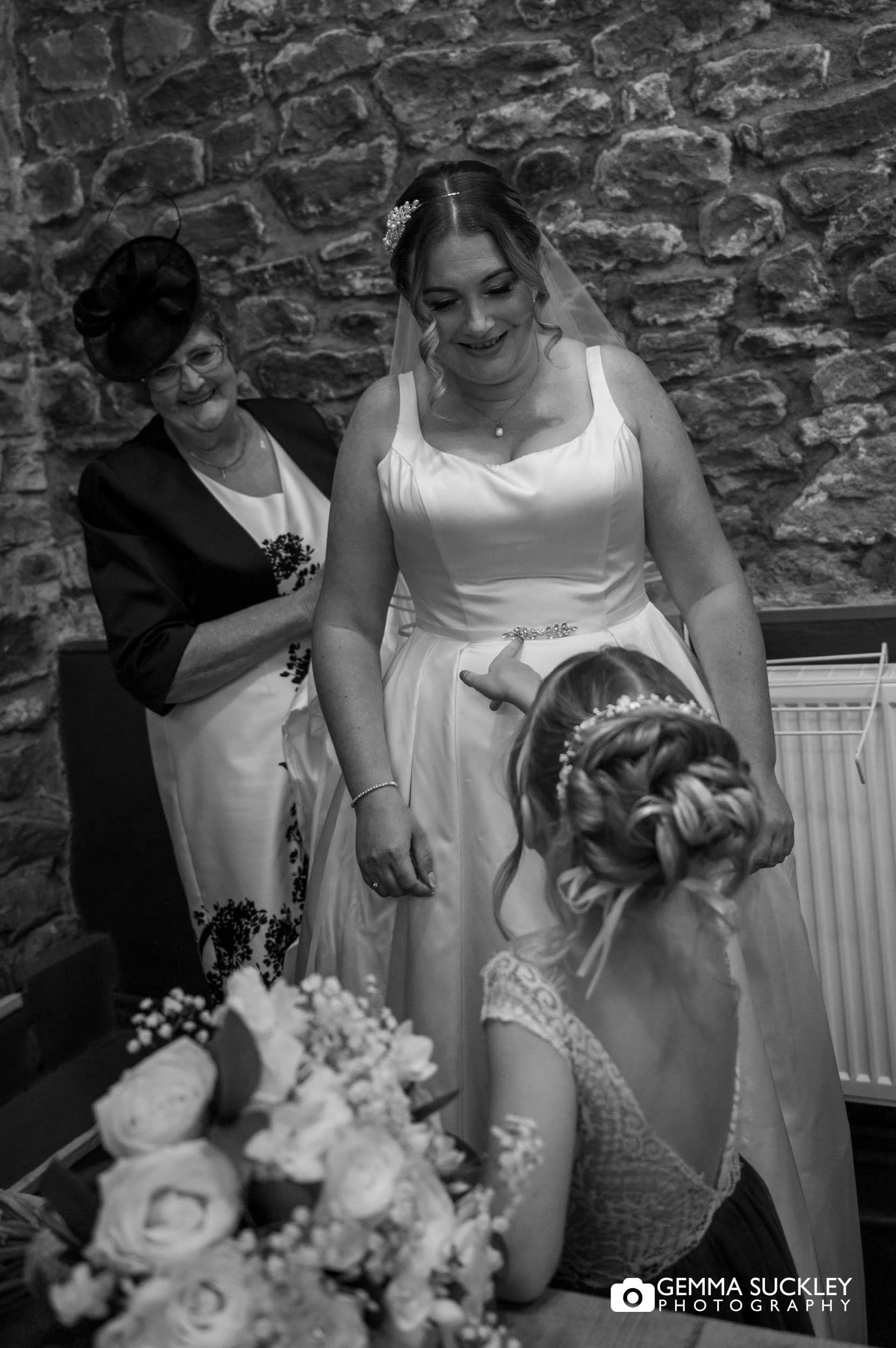 flower girl excited to she the bride in her dress