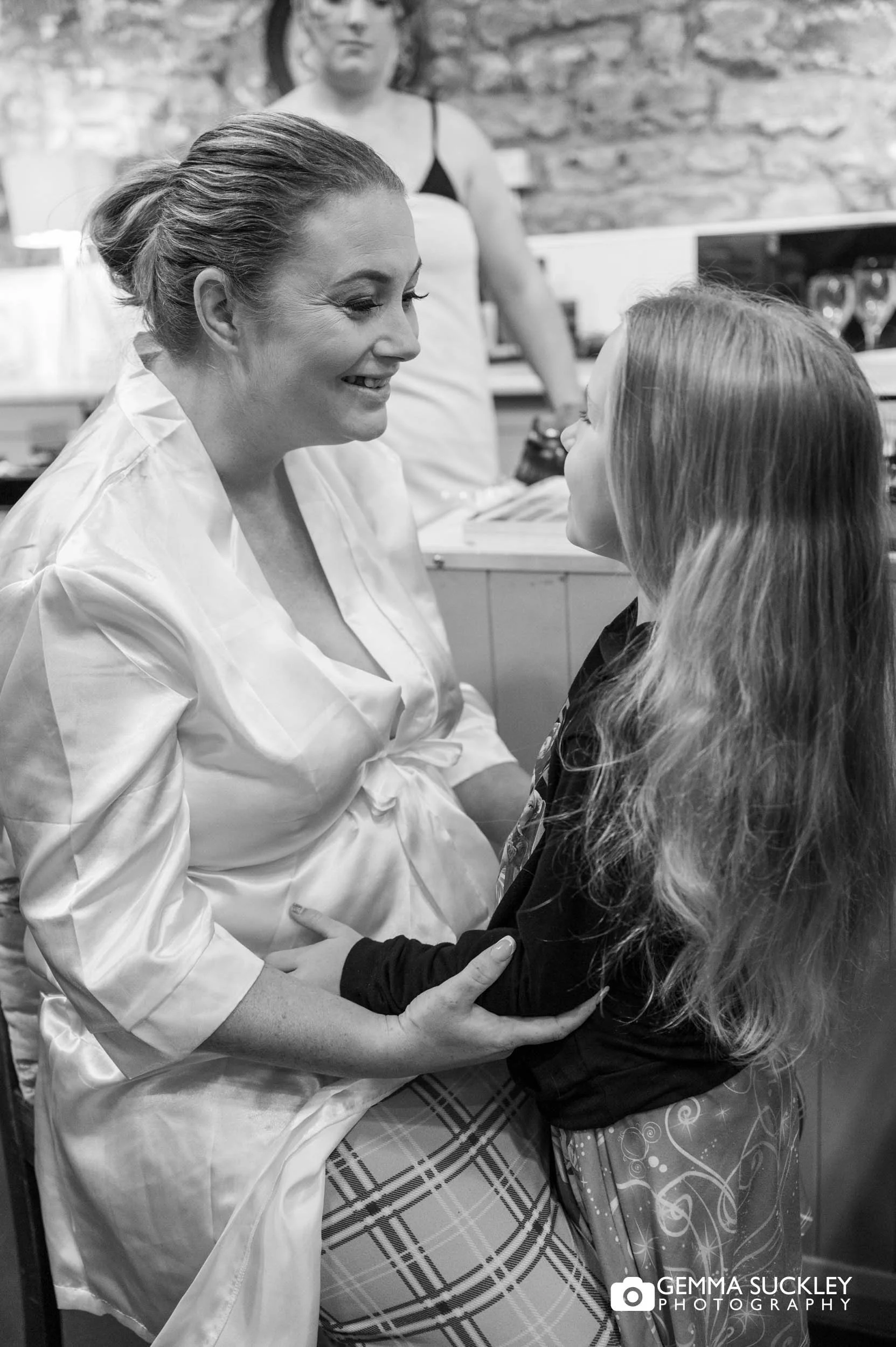 bride and flower girl having a quiet moment