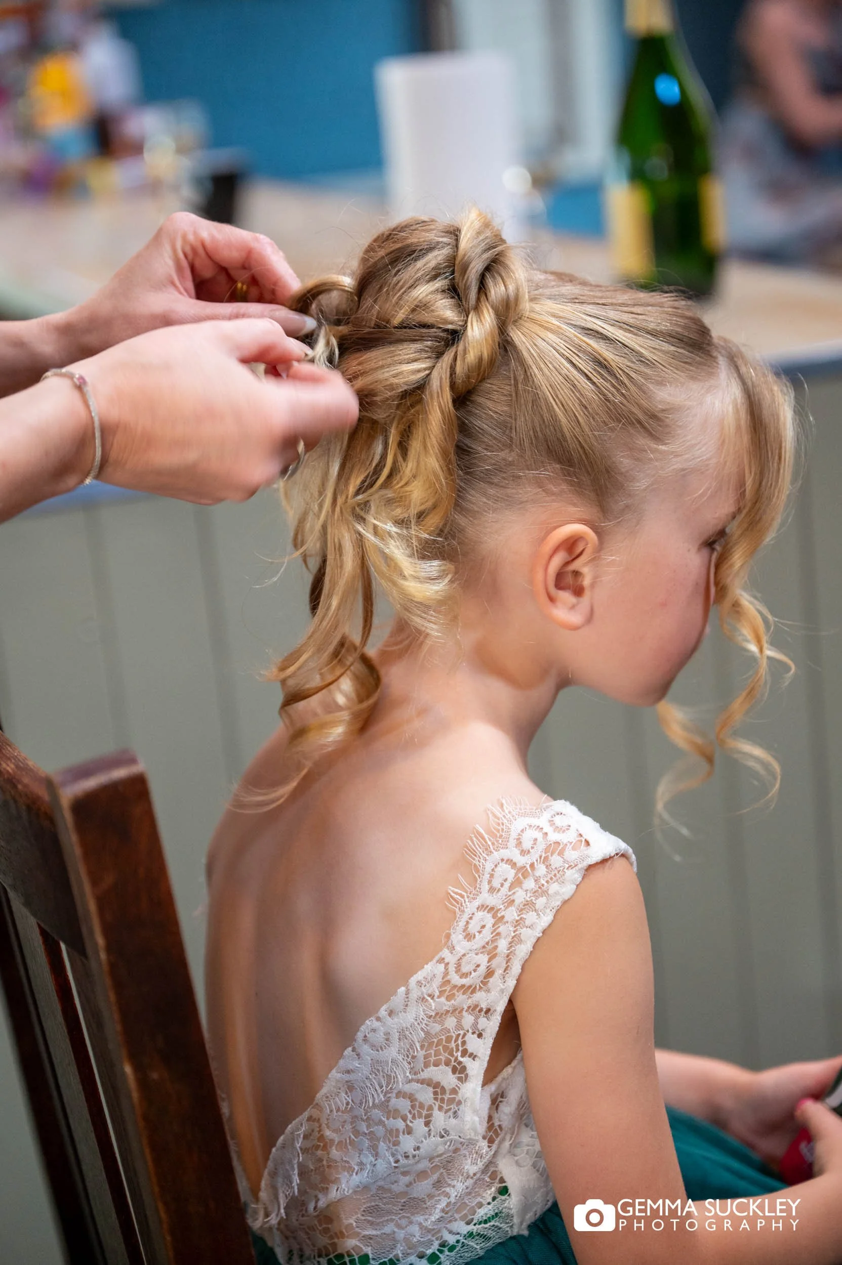 flower girl having her hair done