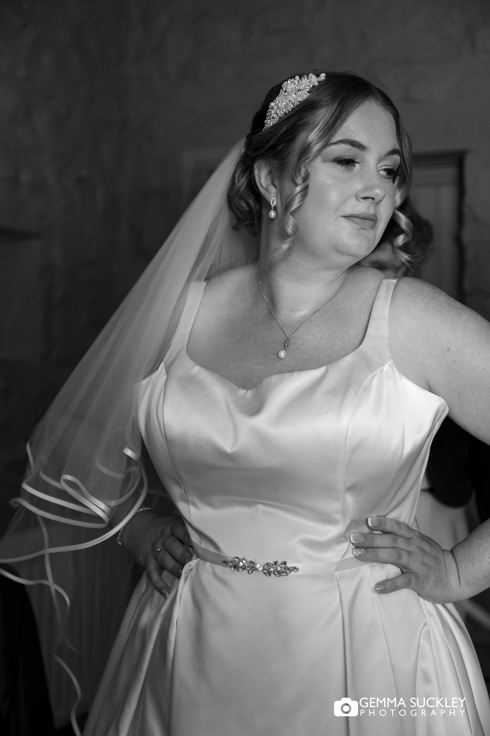 bride getting into her dress