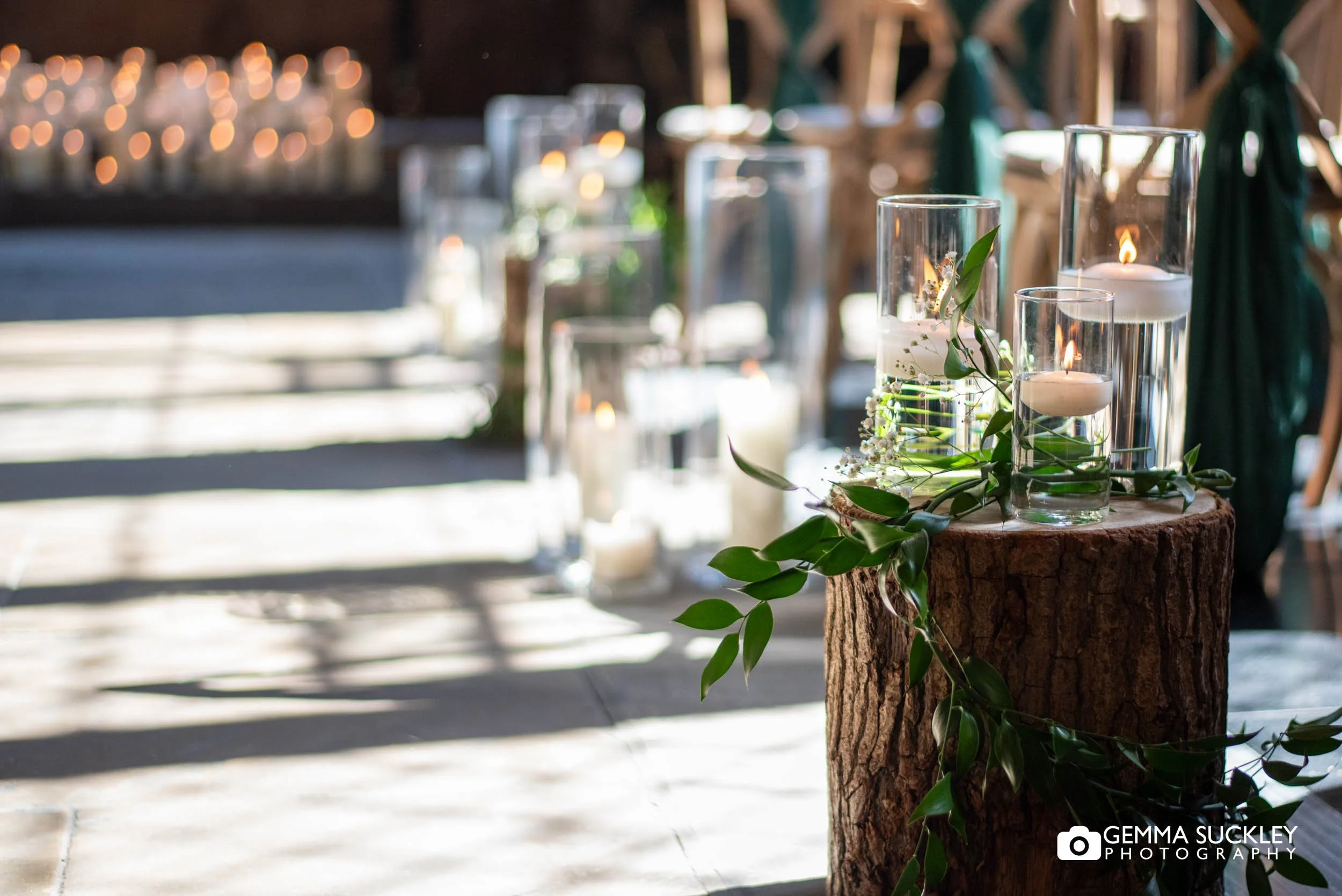 candle and flower decor in the ceremony room