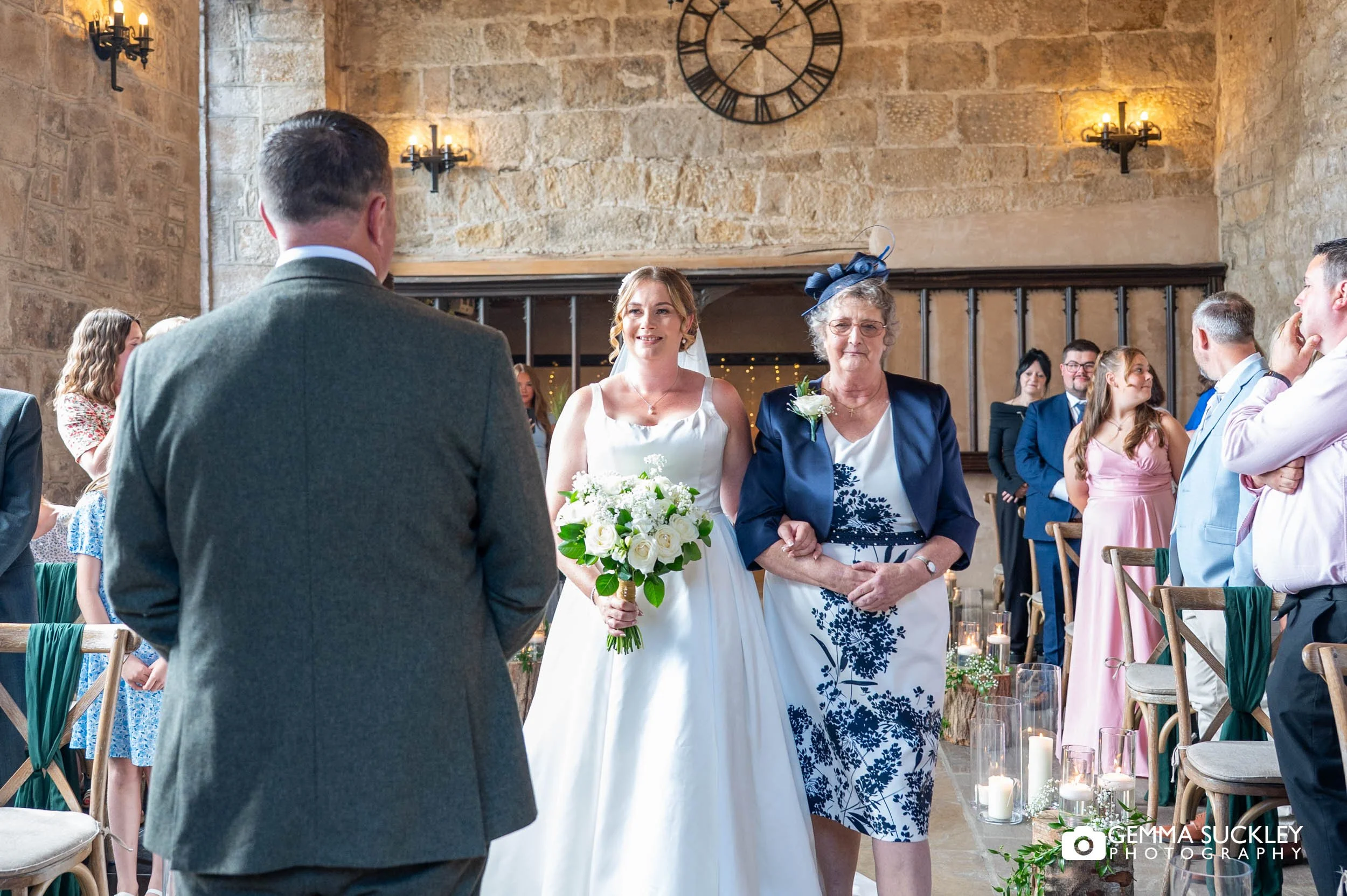 mother of the bride walking her daughter down the aisle 