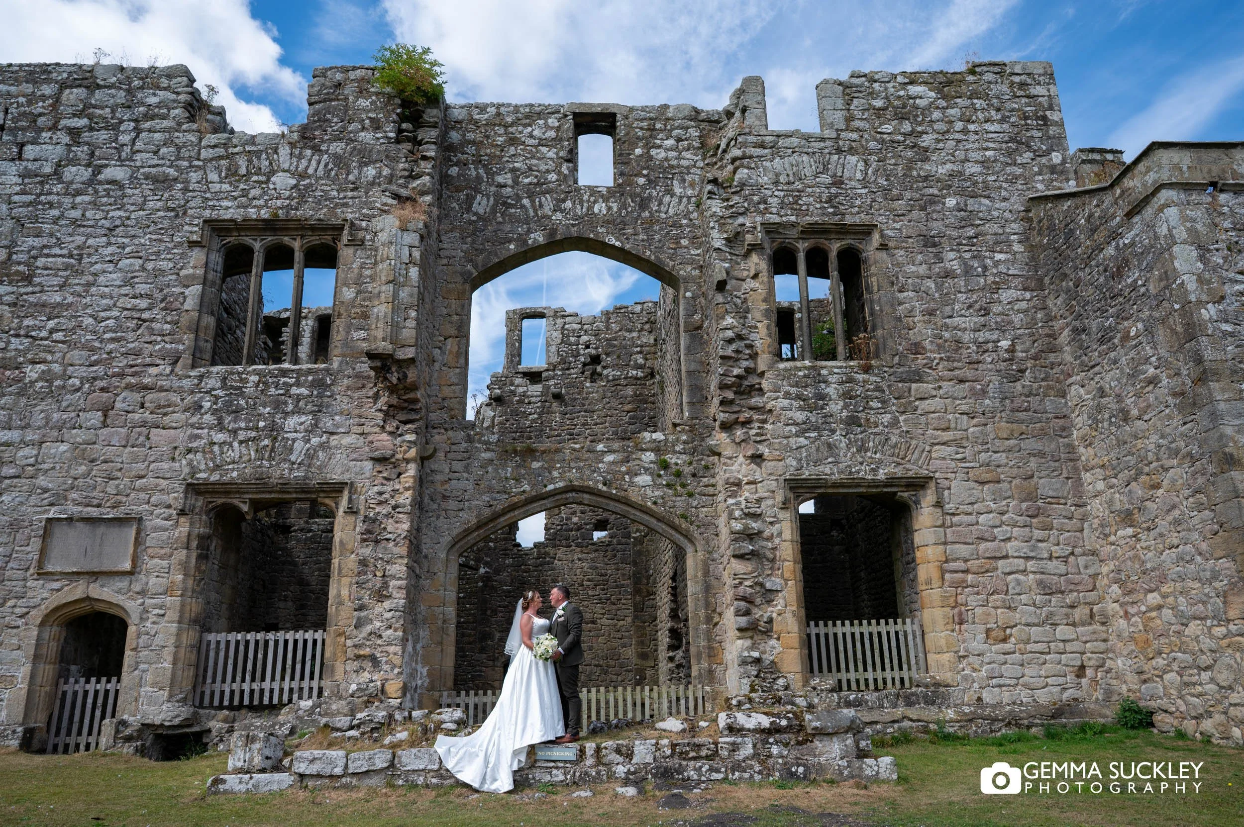 Bride and groom in front Barden Tower