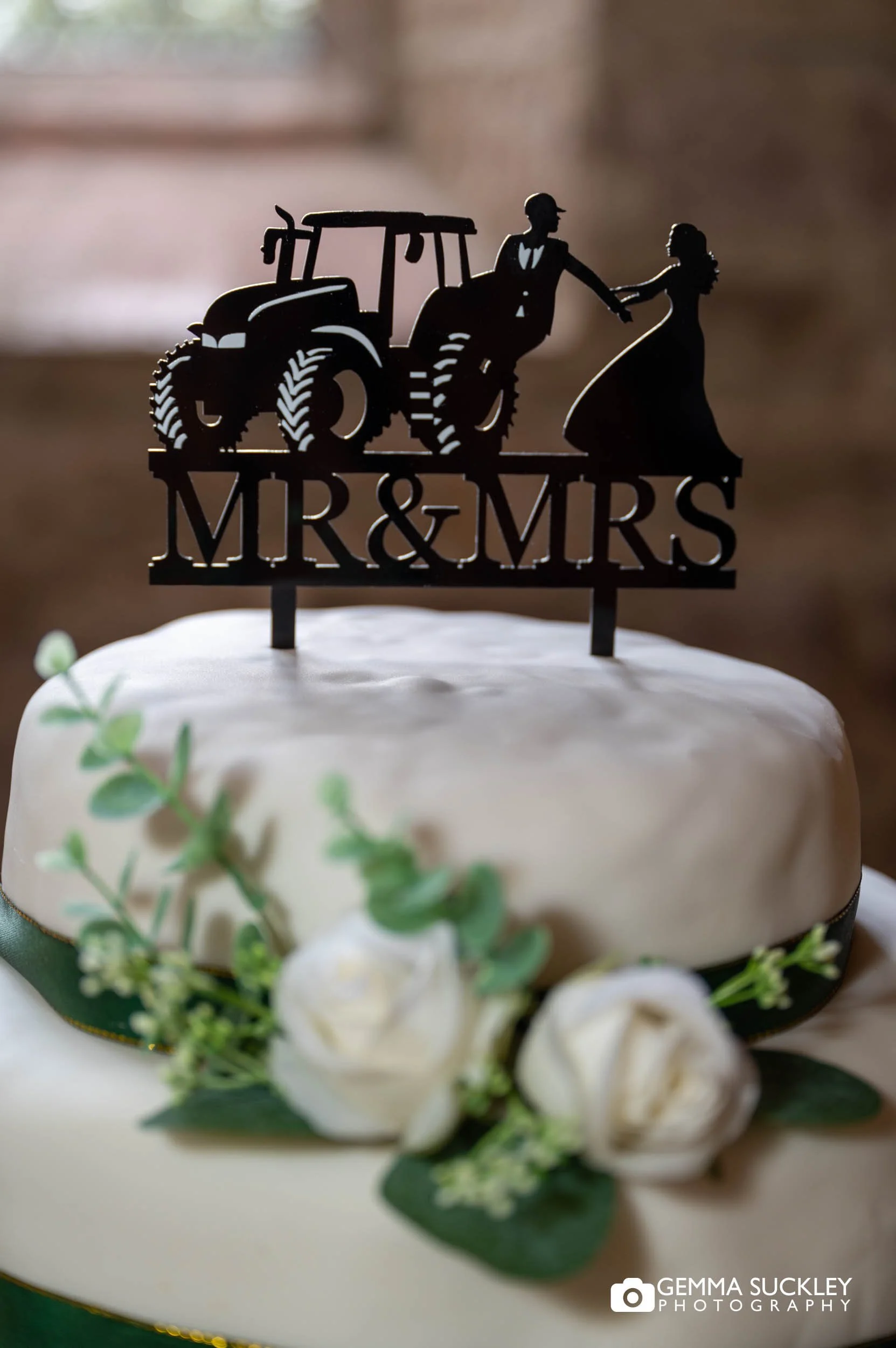 diy wedding cake with a tractor topper