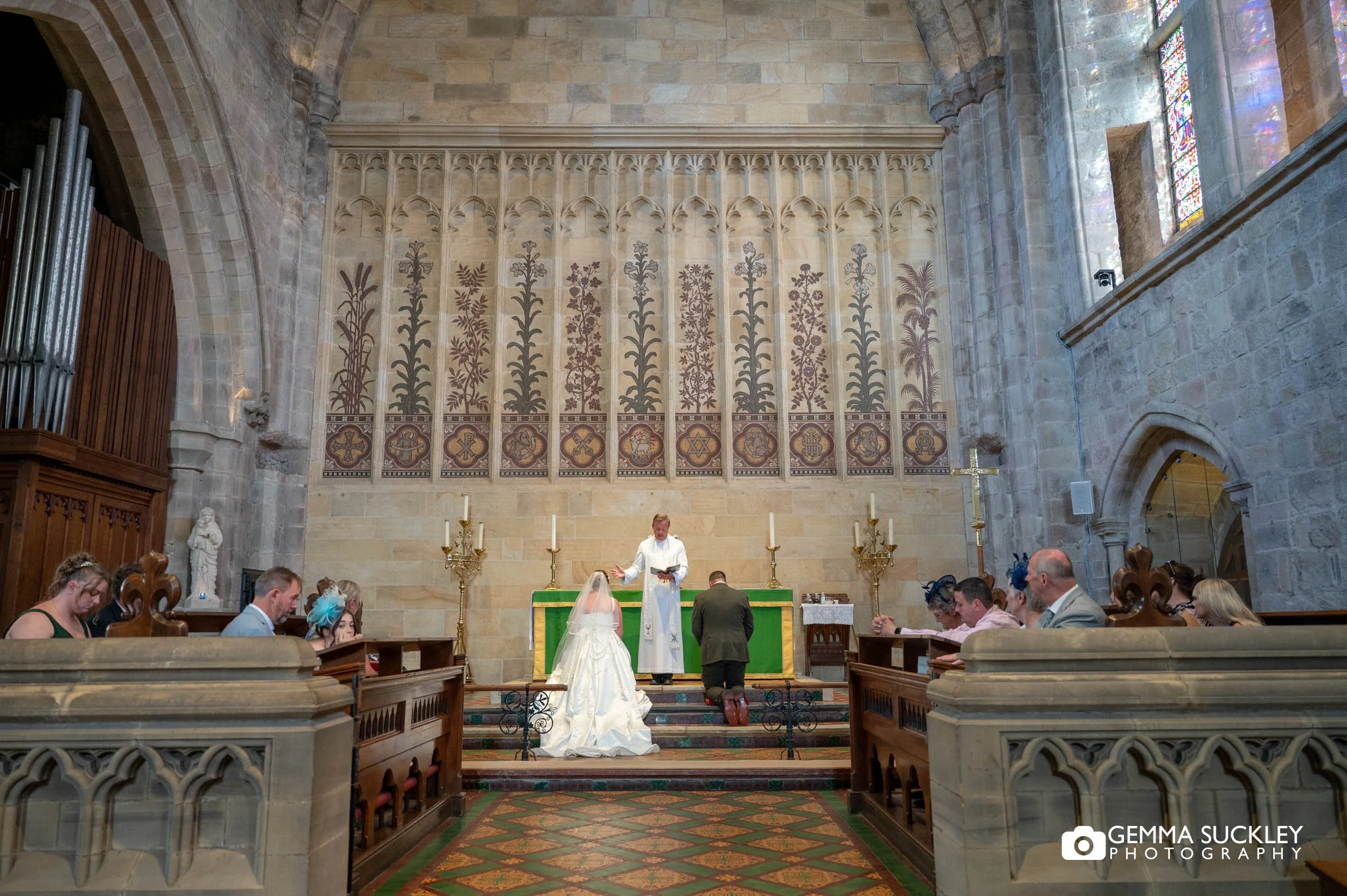 newly-weds being blessed at bolton abbey priory