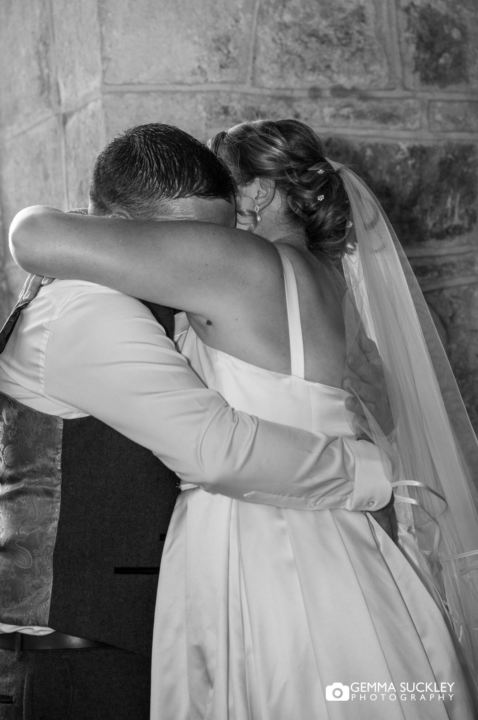 bride and groom sharing a emotional moment during the first dance